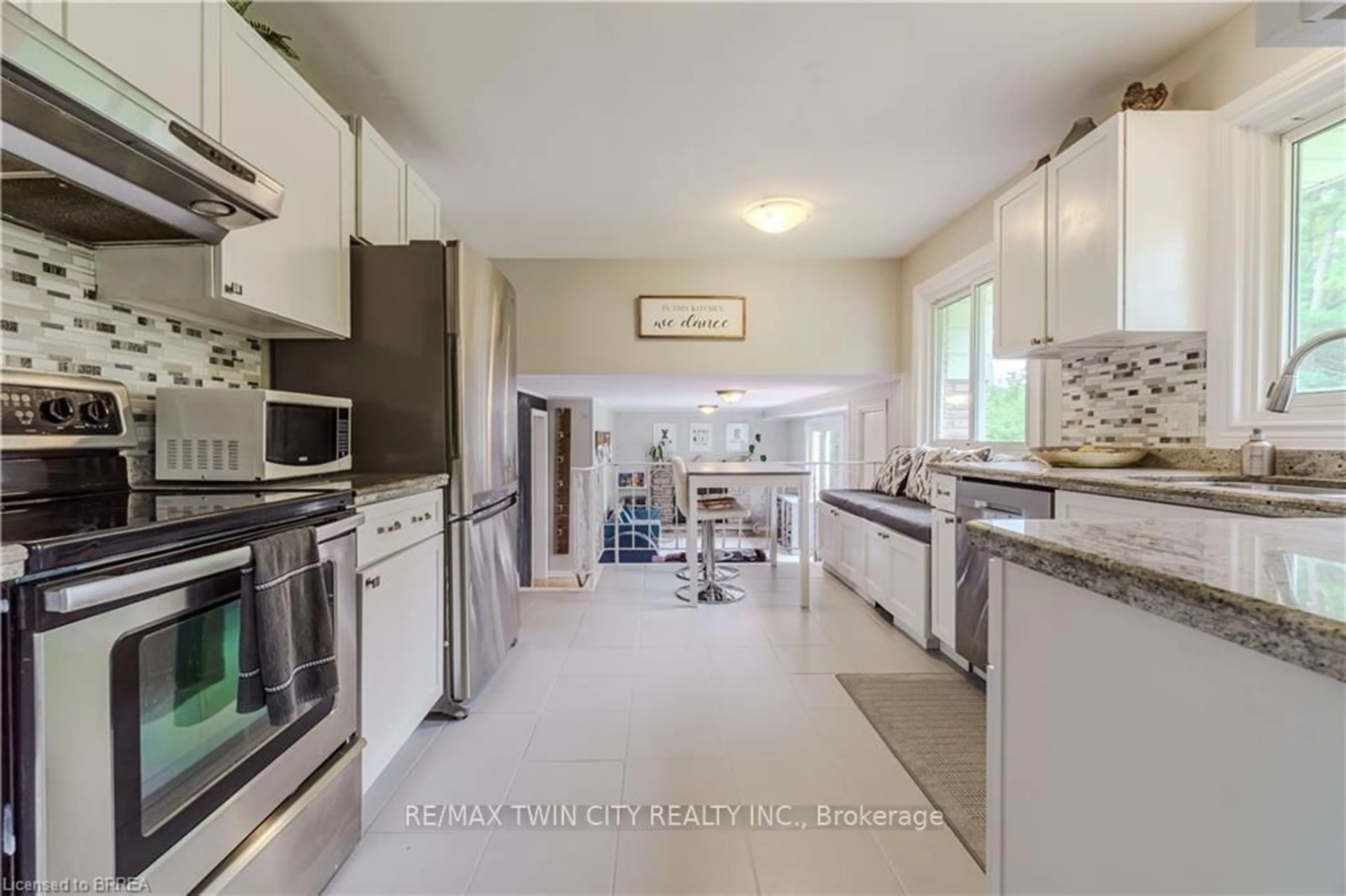 Kitchen with laundary machines, ceramic/tile floor for 22 Japonica Cres, Brantford Ontario N3R 1N6