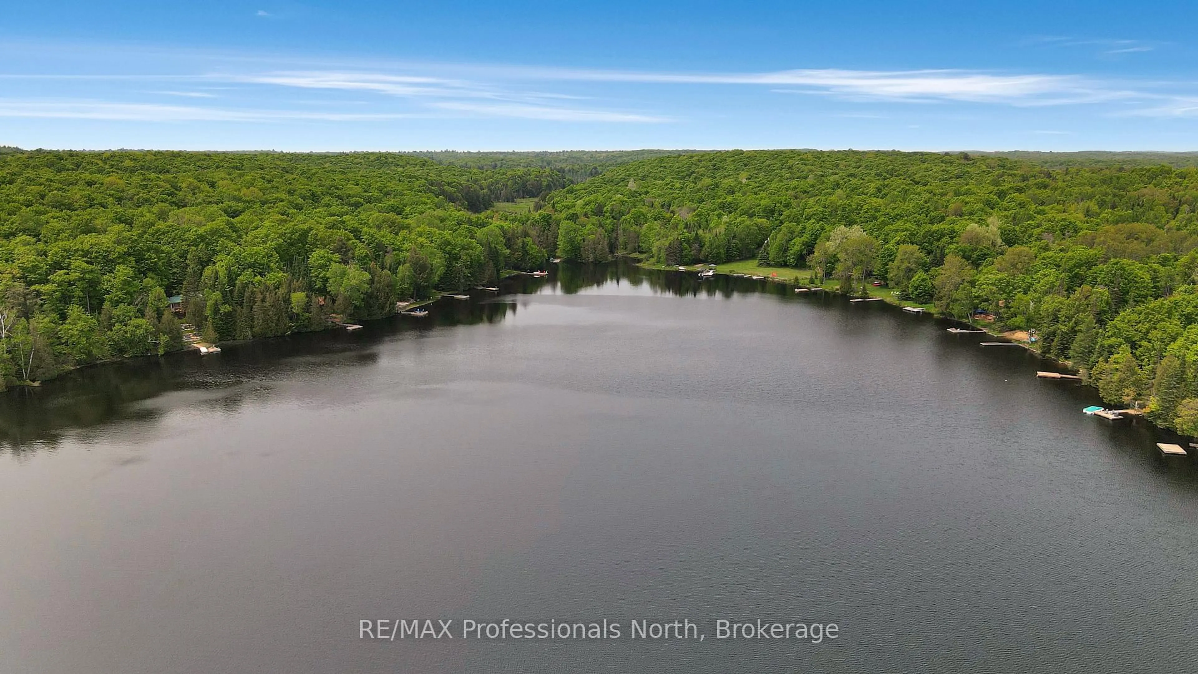 A pic from outside/outdoor area/front of a property/back of a property/a pic from drone, water/lake/river/ocean view for 1998 Alsop Rd, Highlands East Ontario K0M 1R0