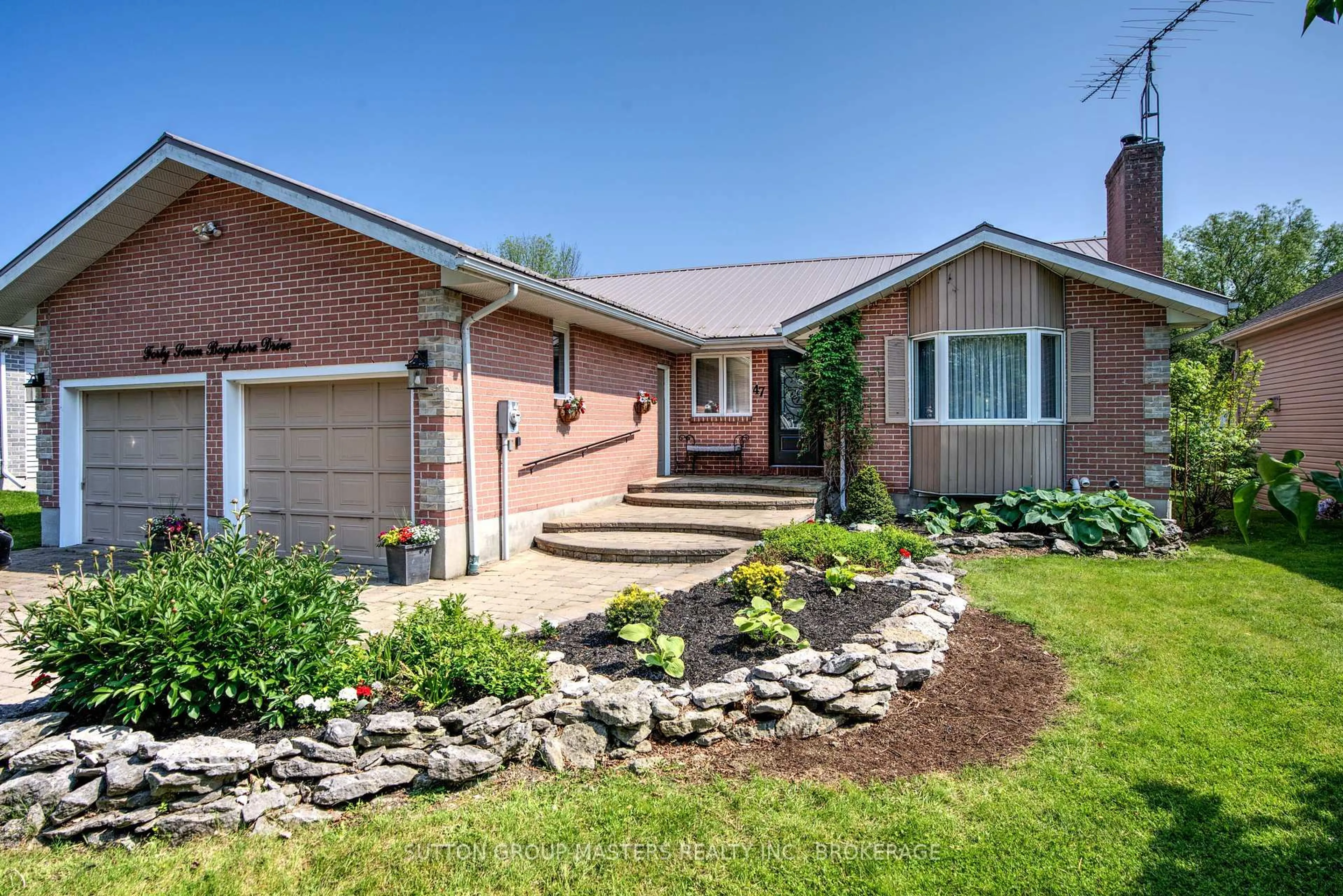 Home with brick exterior material, street for 47 Bayshore Dr, Bath Ontario K0H 1G0