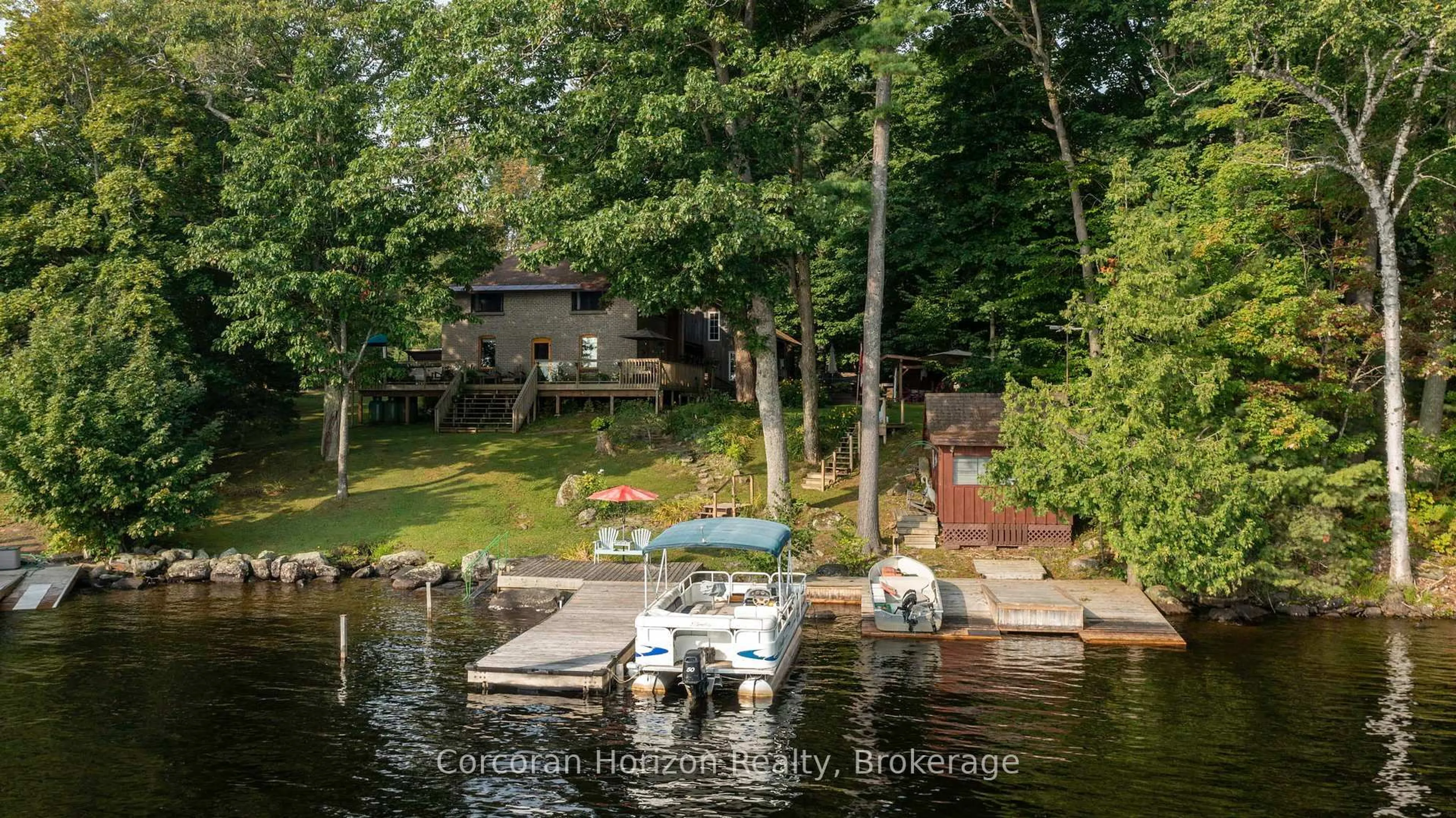 A pic from outside/outdoor area/front of a property/back of a property/a pic from drone, water/lake/river/ocean view for 1641 WALKERS POINT Rd, Muskoka Lakes Ontario P1P 1R2