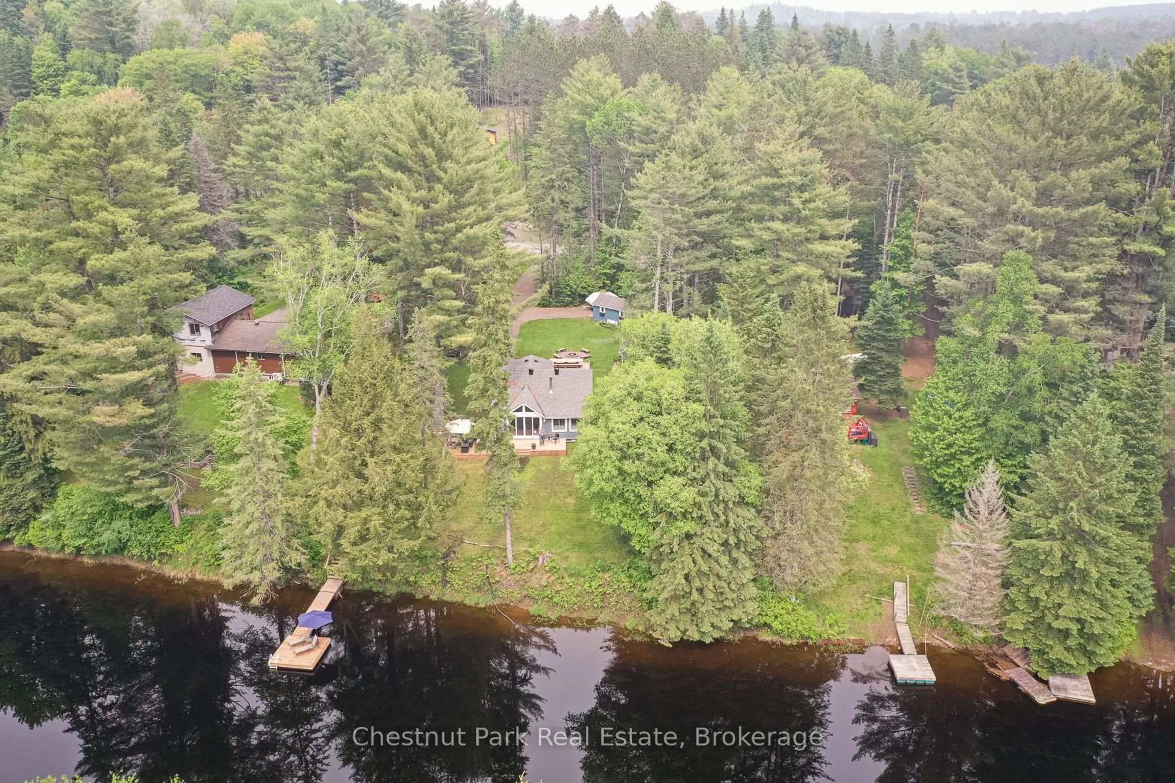 A pic from outside/outdoor area/front of a property/back of a property/a pic from drone, water/lake/river/ocean view for 76 Balsam Chutes Rd, Huntsville Ontario P0B 1L0