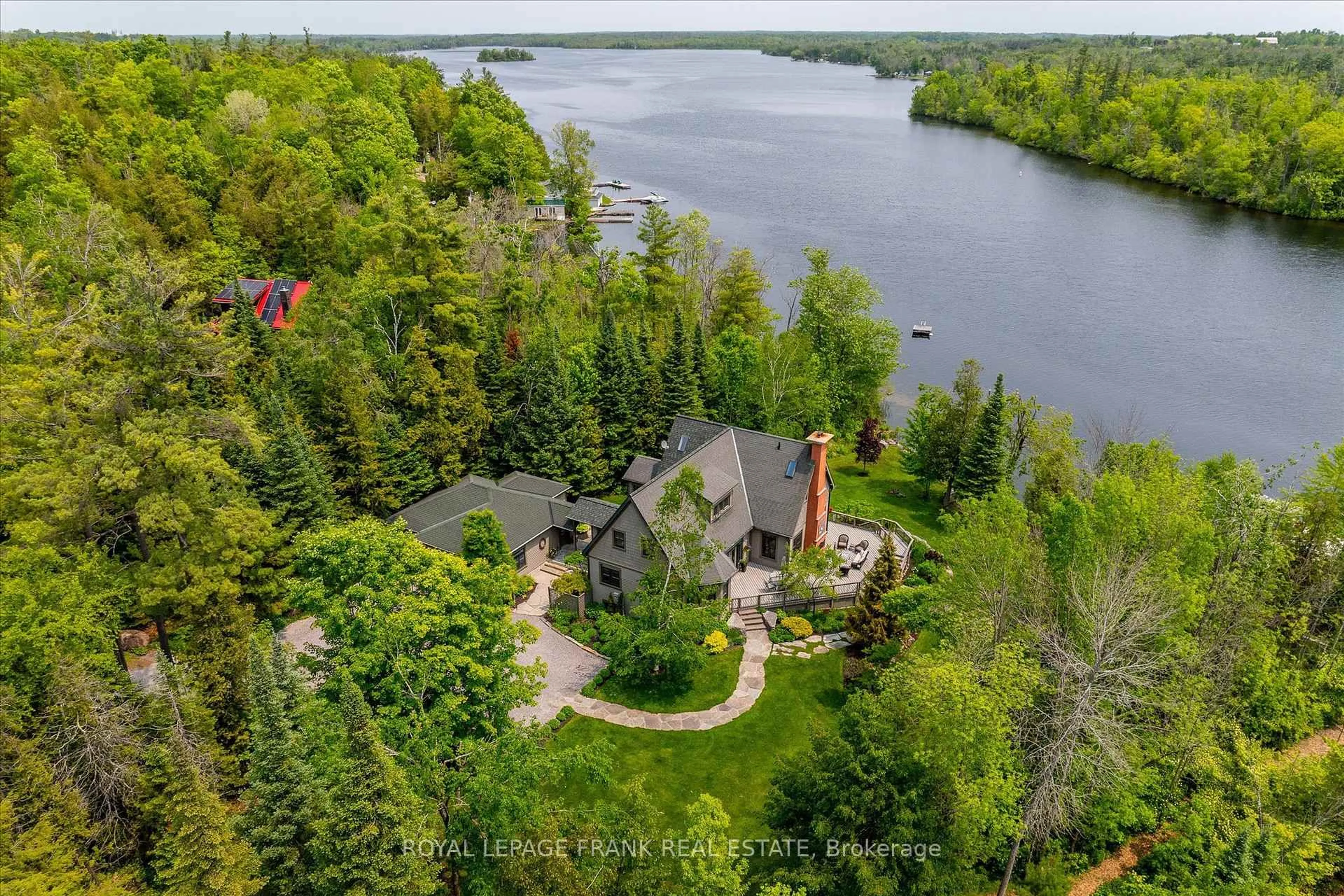 A pic from outside/outdoor area/front of a property/back of a property/a pic from drone, water/lake/river/ocean view for 2187 Marshall Lane, Selwyn Ontario K0L 2H0