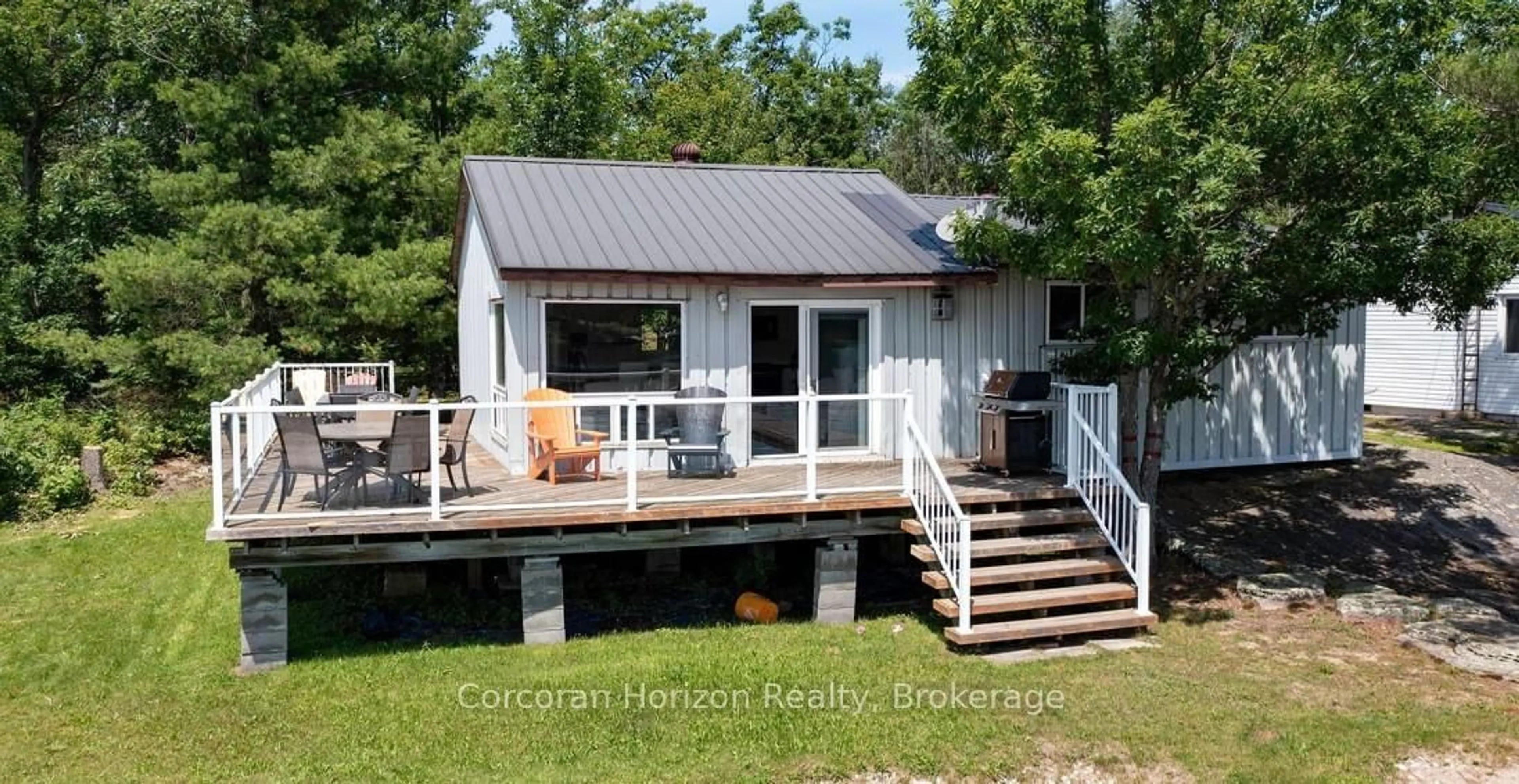 Home with vinyl exterior material, water/lake/river/ocean view for 64 Wolverine Beach Rd, Georgian Bay Ontario L0K 1S0