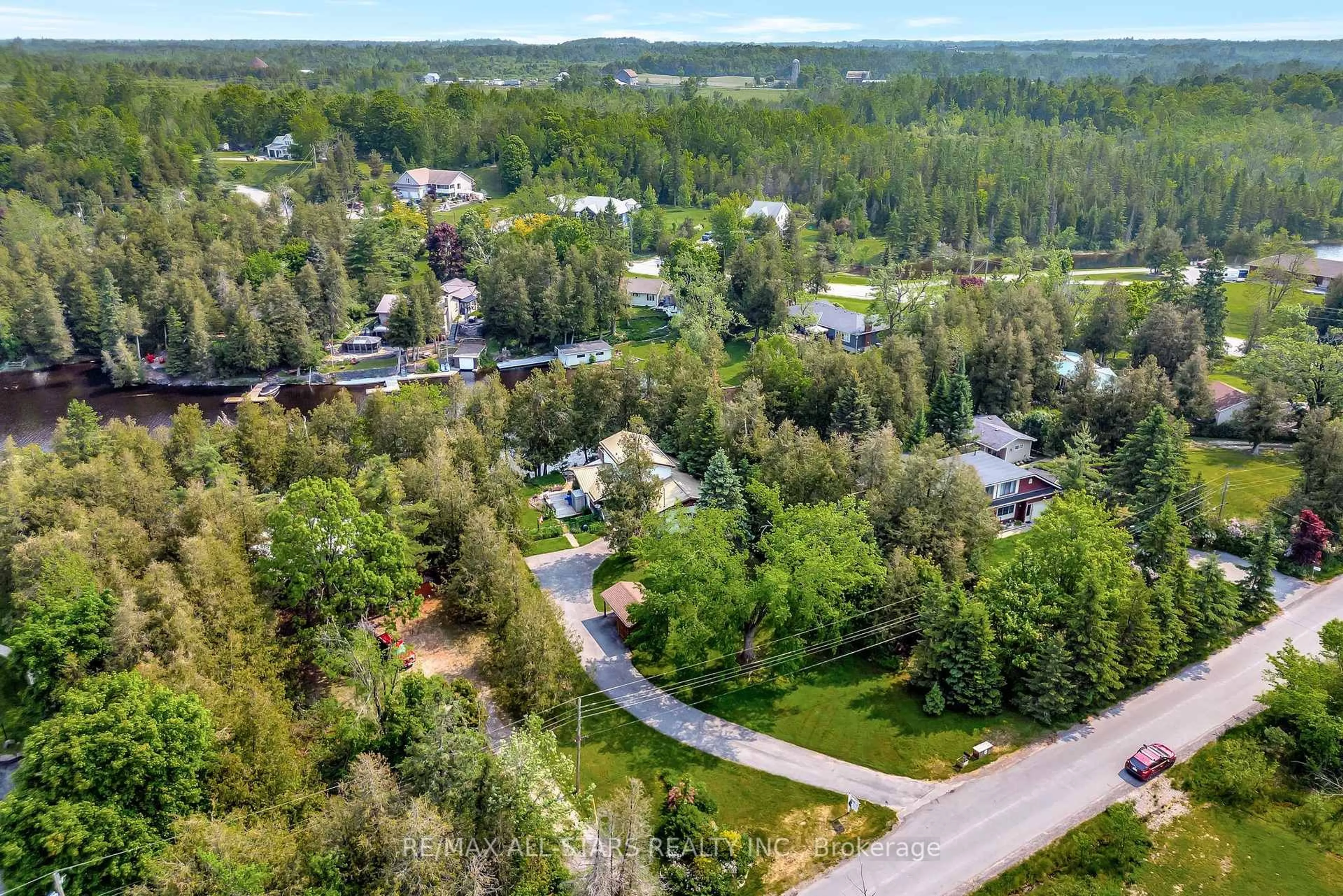 A pic from outside/outdoor area/front of a property/back of a property/a pic from drone, forest/trees view for 14 Wychwood Dr, Kawartha Lakes Ontario K0M 1N0
