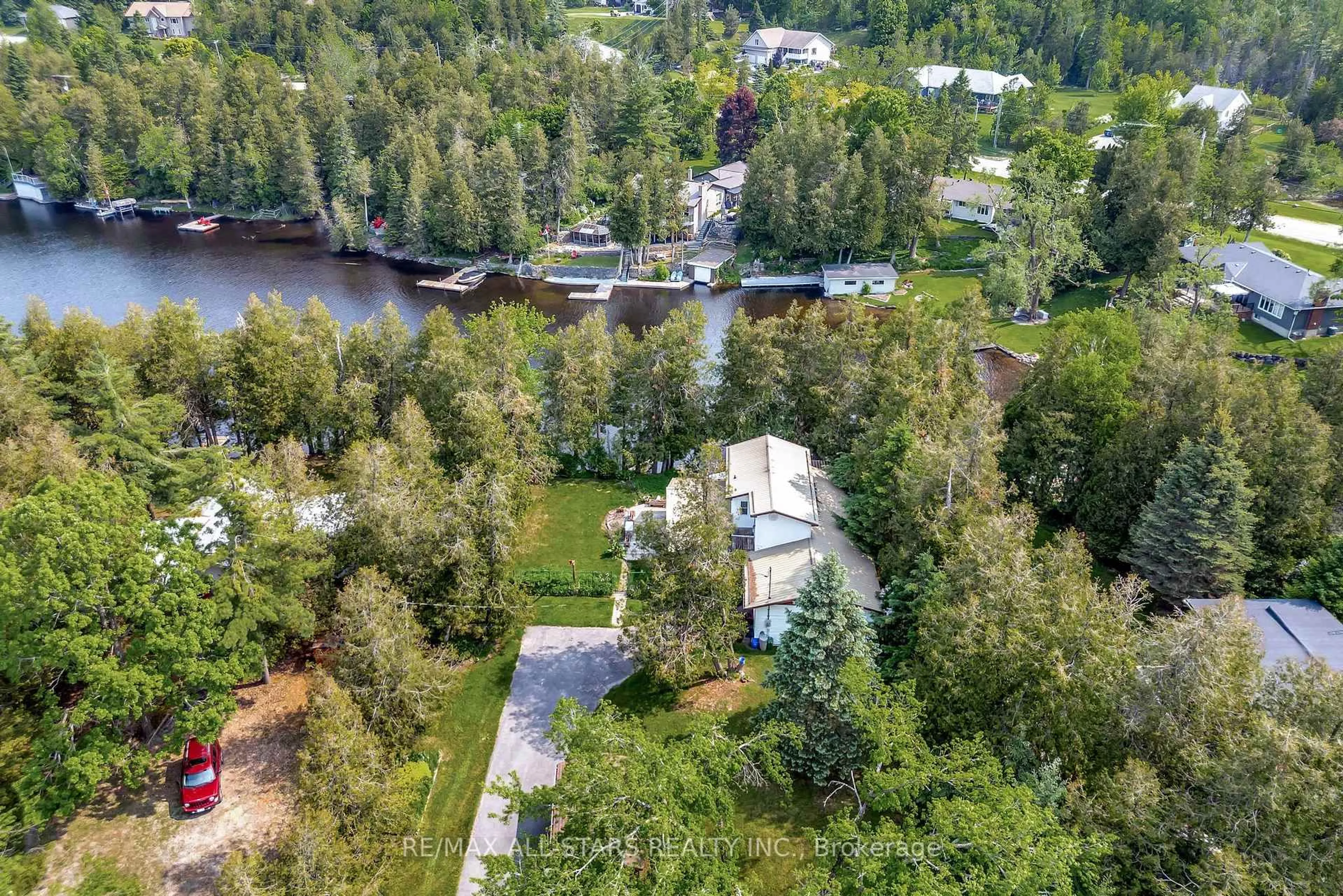 A pic from outside/outdoor area/front of a property/back of a property/a pic from drone, water/lake/river/ocean view for 14 Wychwood Dr, Kawartha Lakes Ontario K0M 1N0