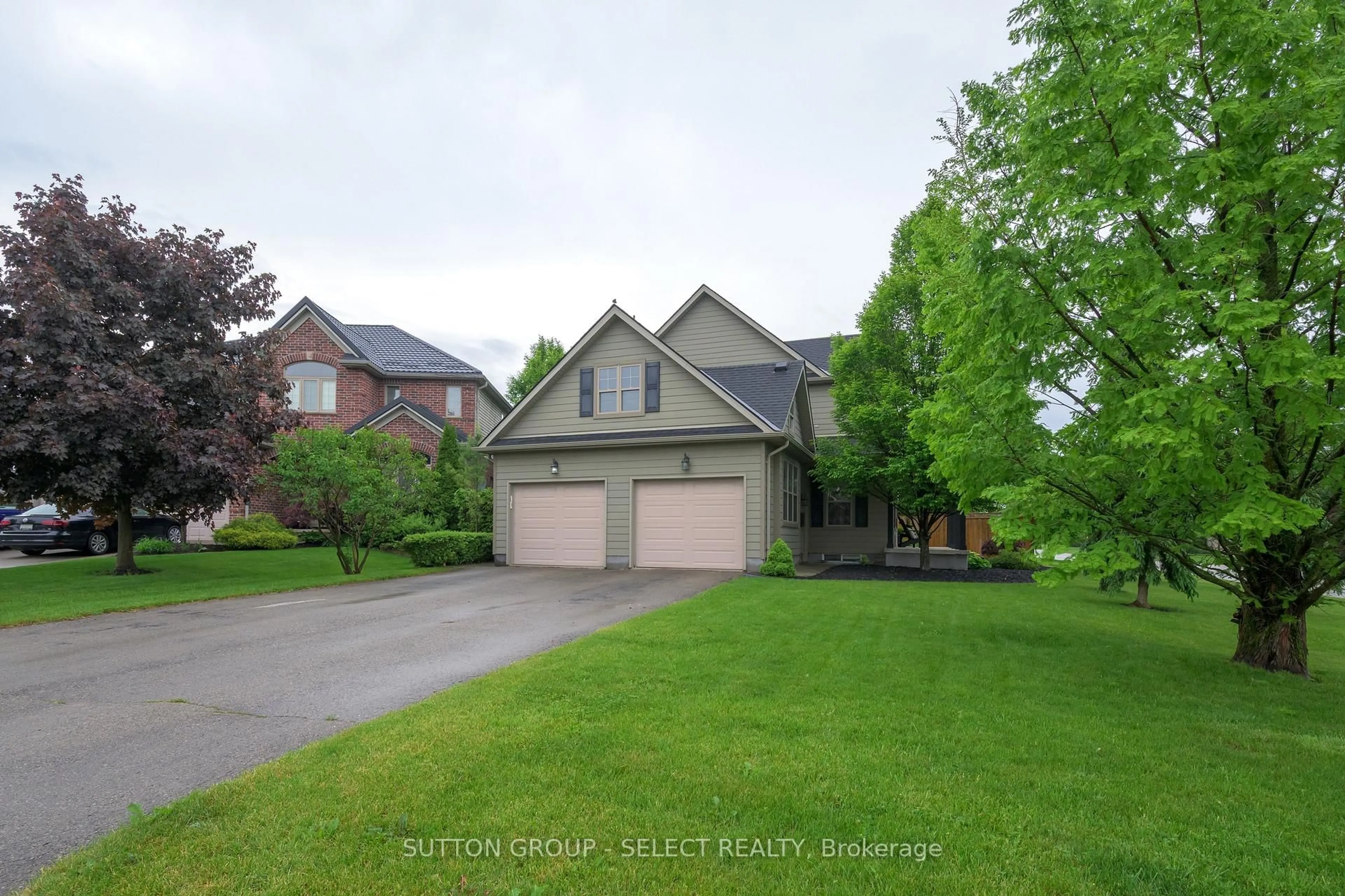 A pic from outside/outdoor area/front of a property/back of a property/a pic from drone, street for 106 Woodlily Lane, Middlesex Centre Ontario N0M 2A0