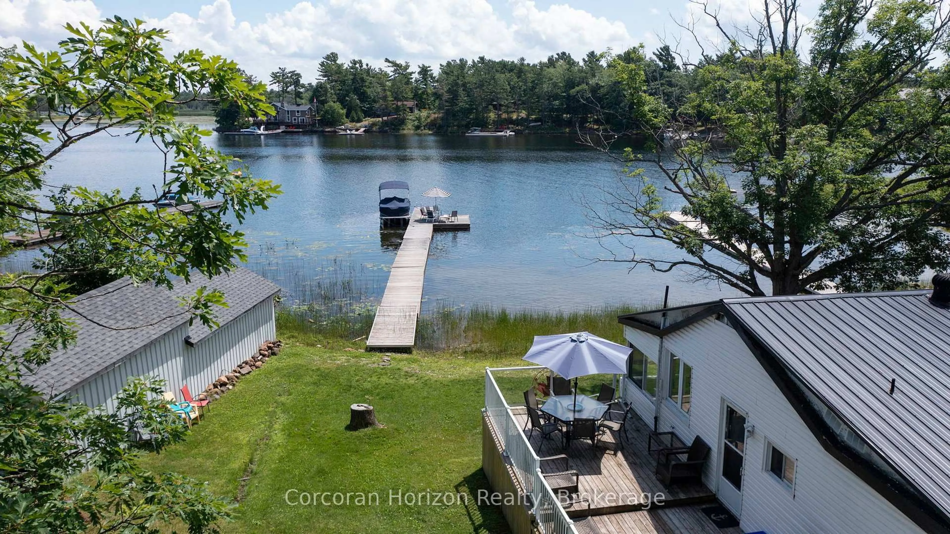 A pic from outside/outdoor area/front of a property/back of a property/a pic from drone, water/lake/river/ocean view for 68 WOLVERINE BEACH RD, Georgian Bay Ontario P0E 1E0