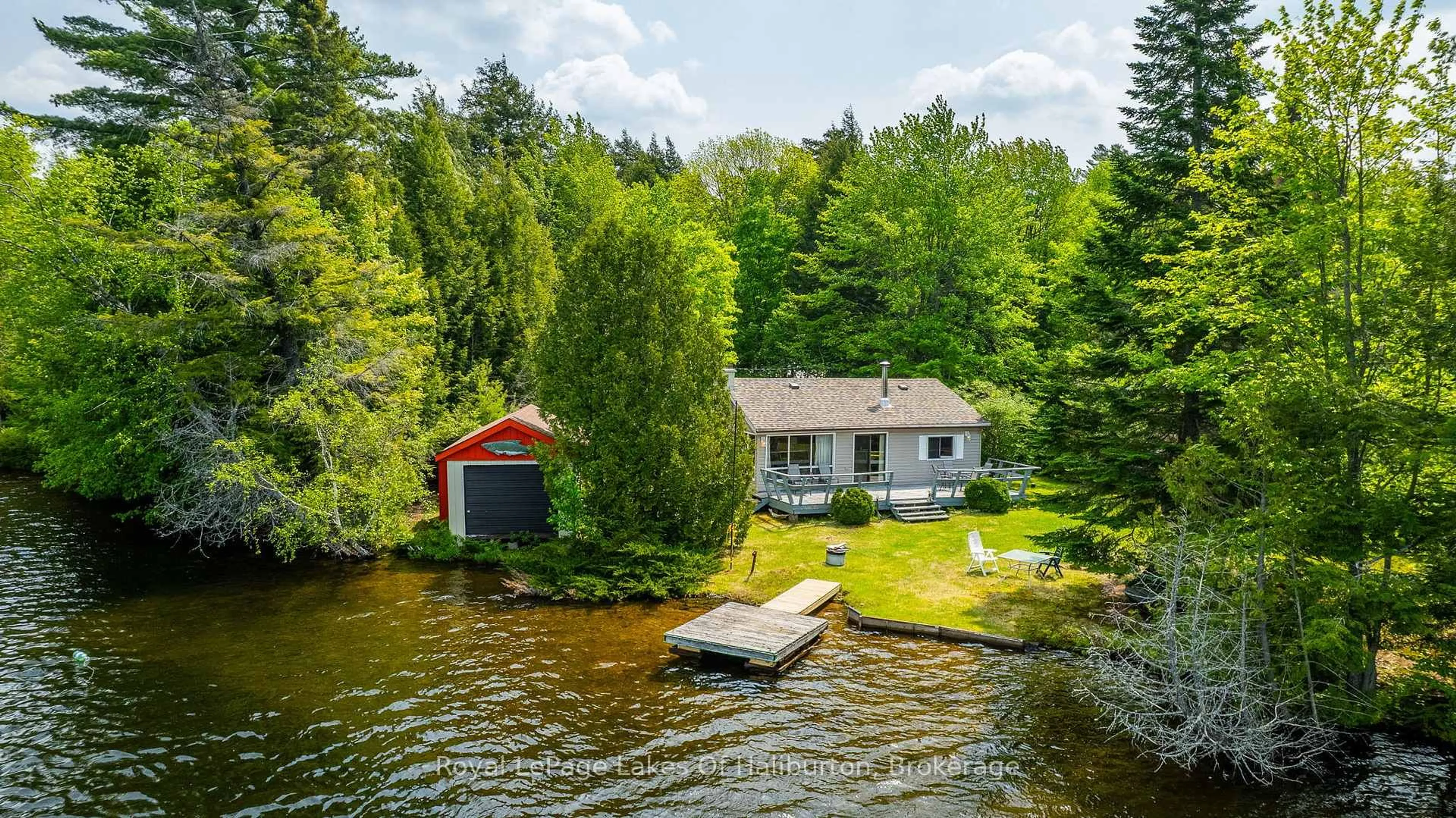 A pic from outside/outdoor area/front of a property/back of a property/a pic from drone, water/lake/river/ocean view for 1058 DOREEN'S Lane, Highlands East Ontario K0L 2Y0