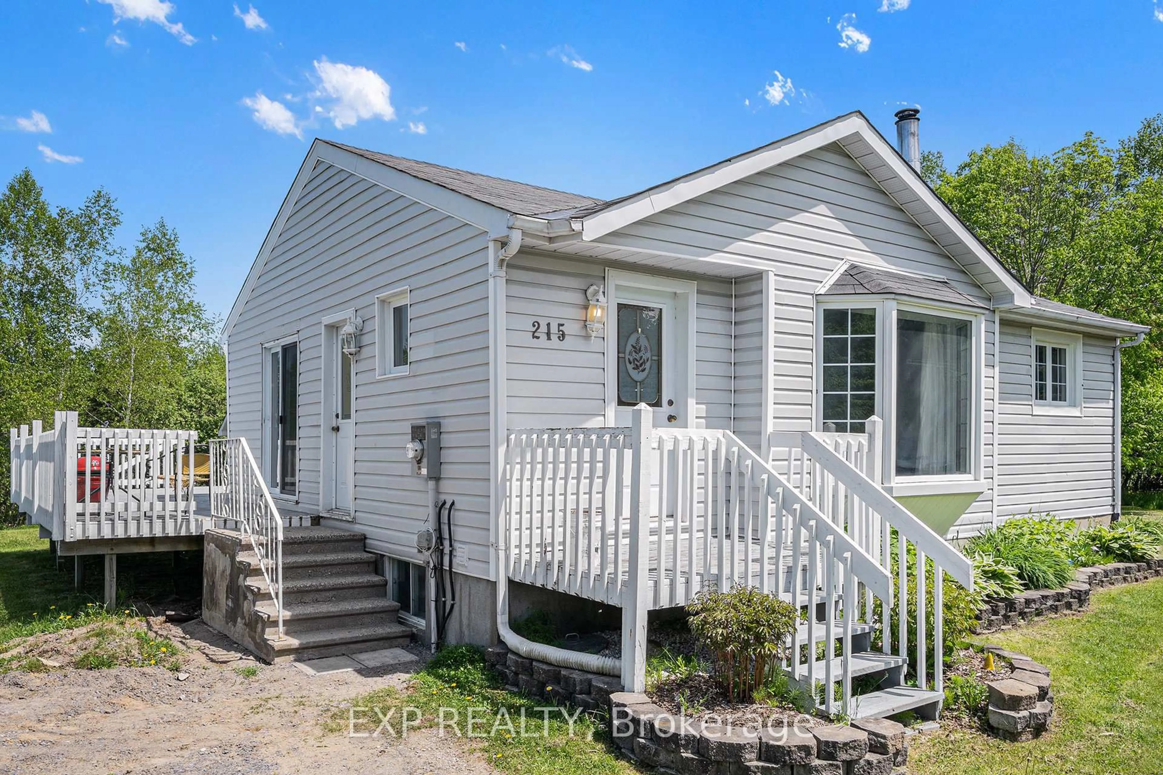 Home with vinyl exterior material, street for 215 St Thomas Rd, Russell Ontario K0A 3H0