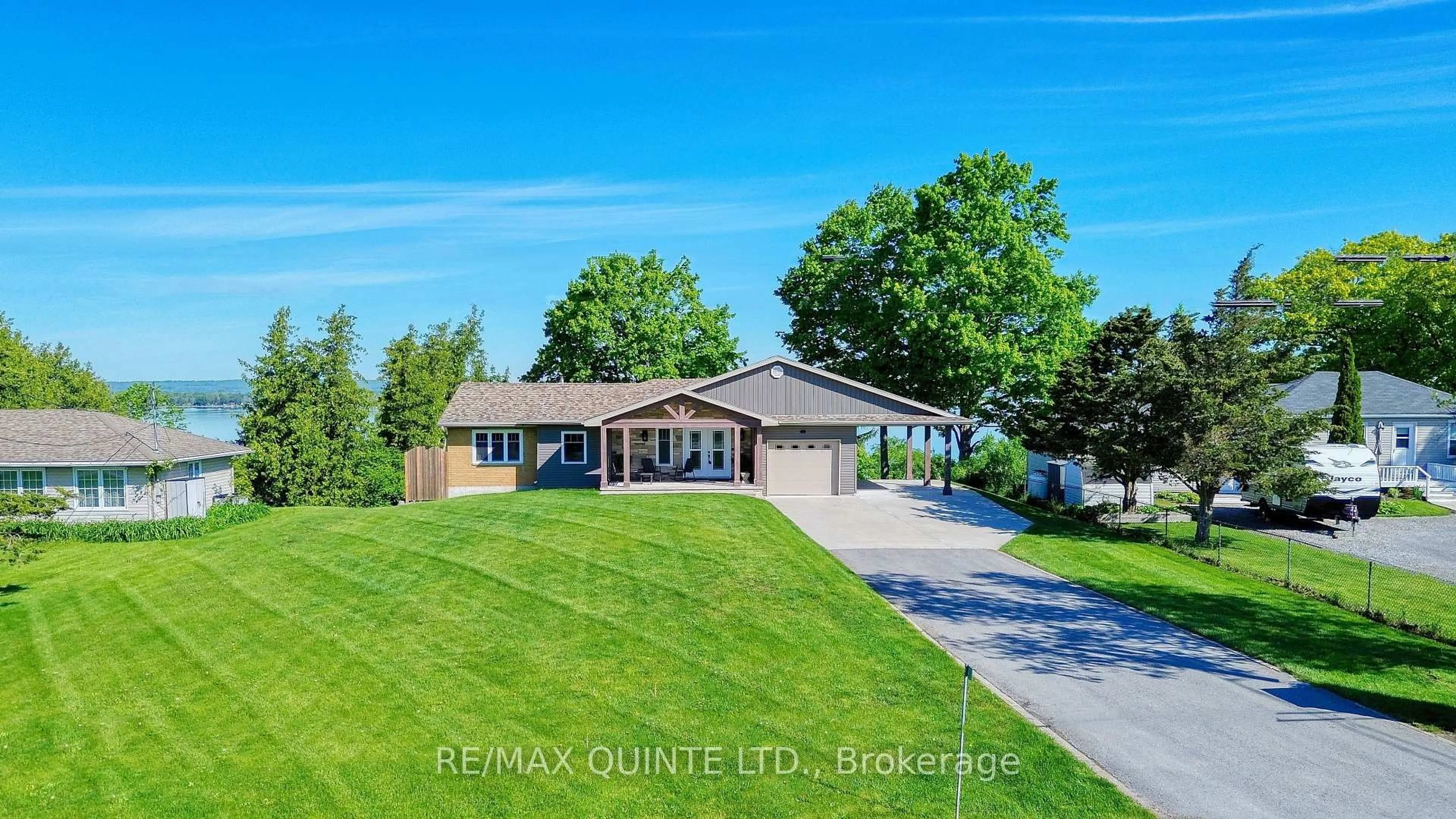 A pic from outside/outdoor area/front of a property/back of a property/a pic from drone, water/lake/river/ocean view for 3400 County Road 3, Prince Edward County Ontario K0K 1L0