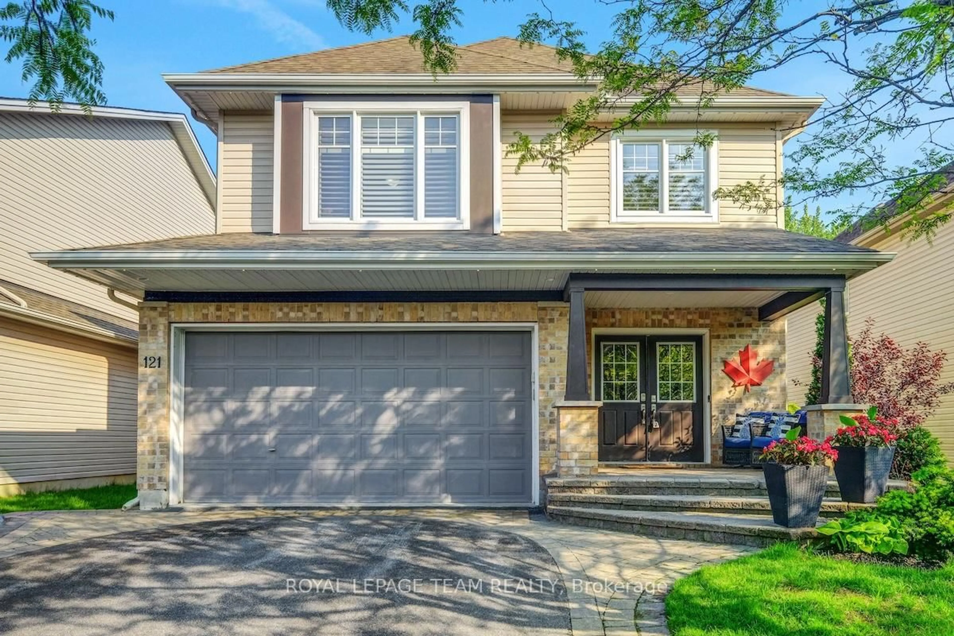 Home with vinyl exterior material, street for 121 Bandelier Way, Ottawa Ontario K2S 0C2