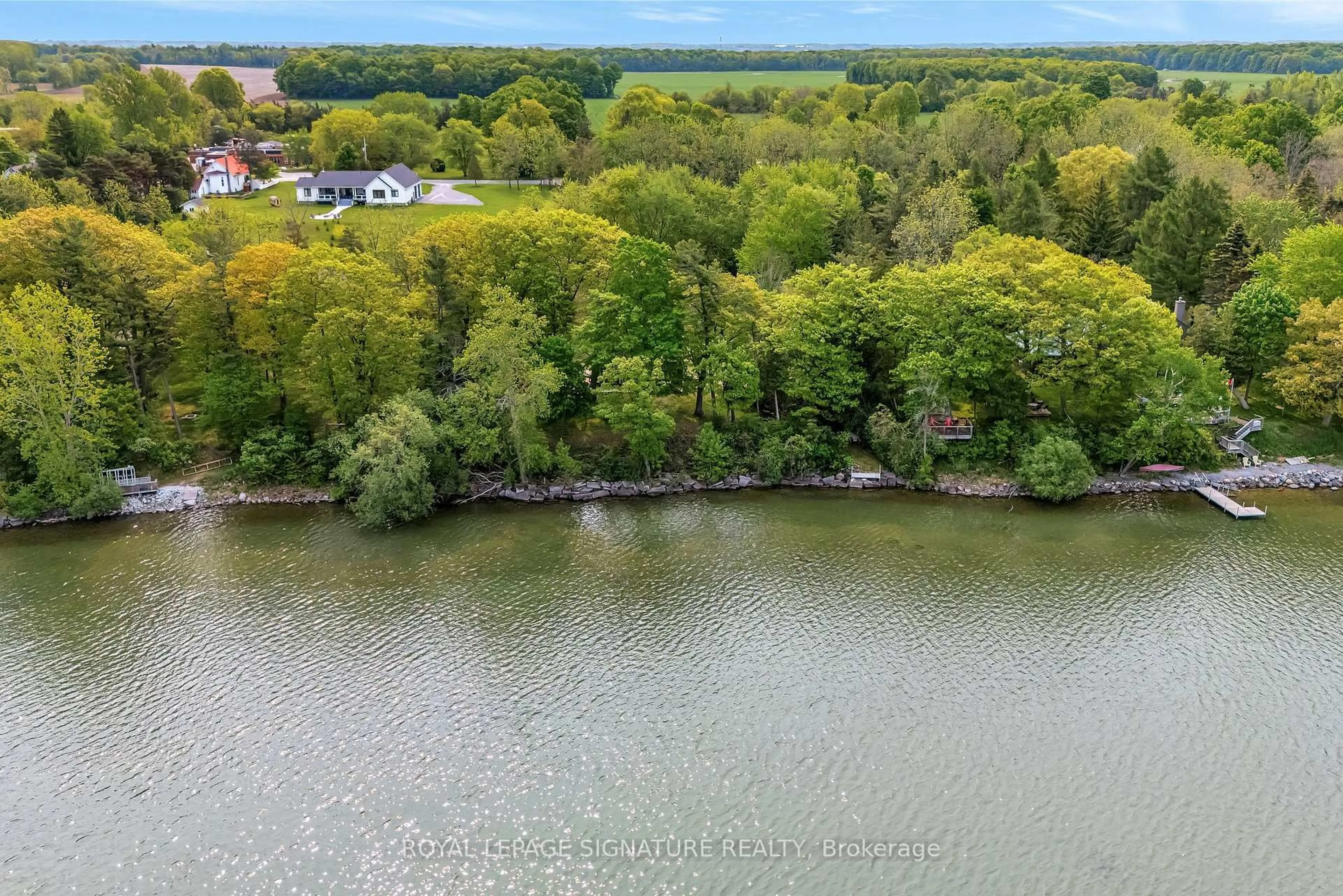 A pic from outside/outdoor area/front of a property/back of a property/a pic from drone, water/lake/river/ocean view for 27 Thrush Lane, Prince Edward County Ontario K0K 2T0