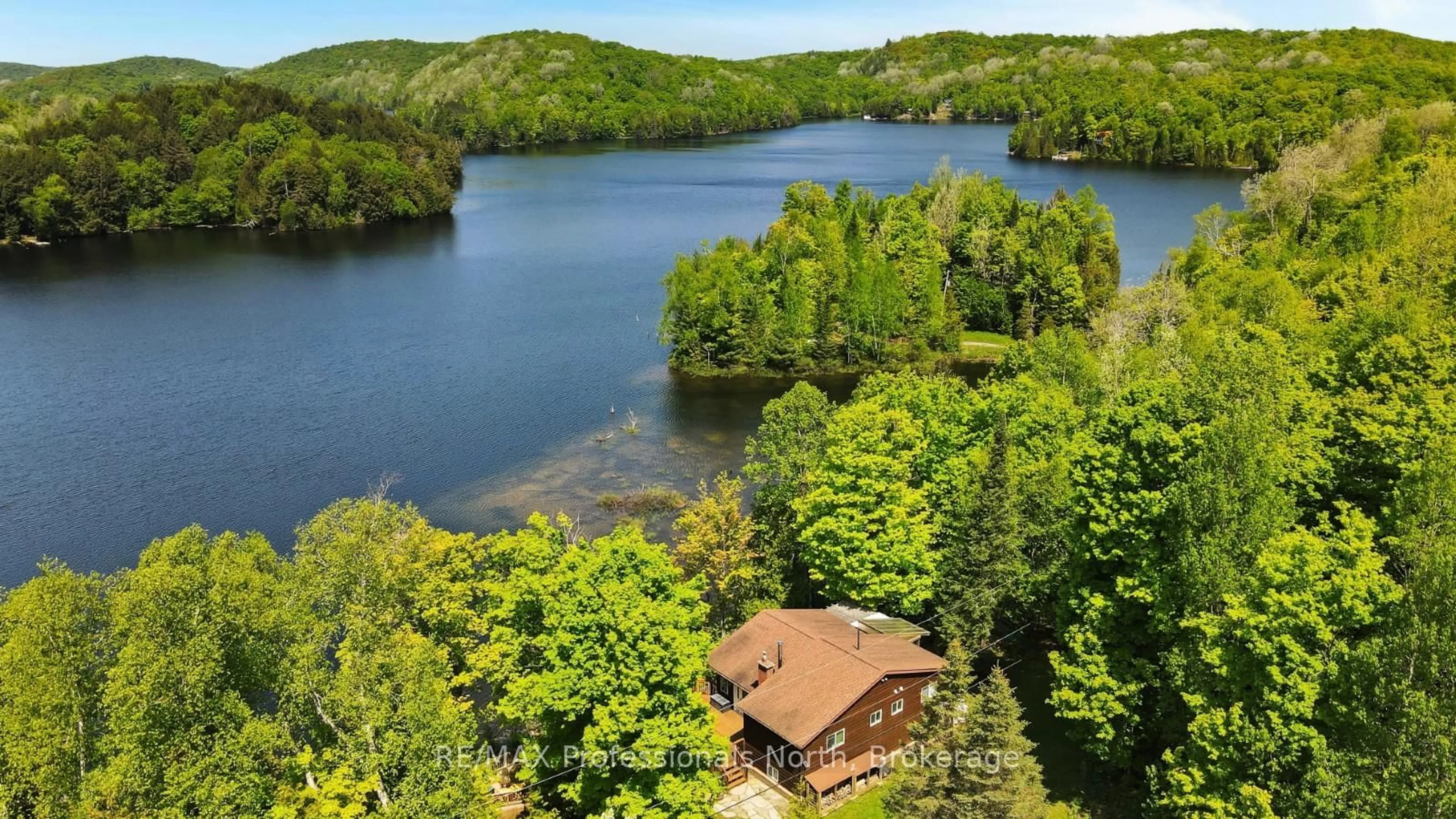 A pic from outside/outdoor area/front of a property/back of a property/a pic from drone, water/lake/river/ocean view for 1943 Essonville Line, Highlands East Ontario K0L 2Y0