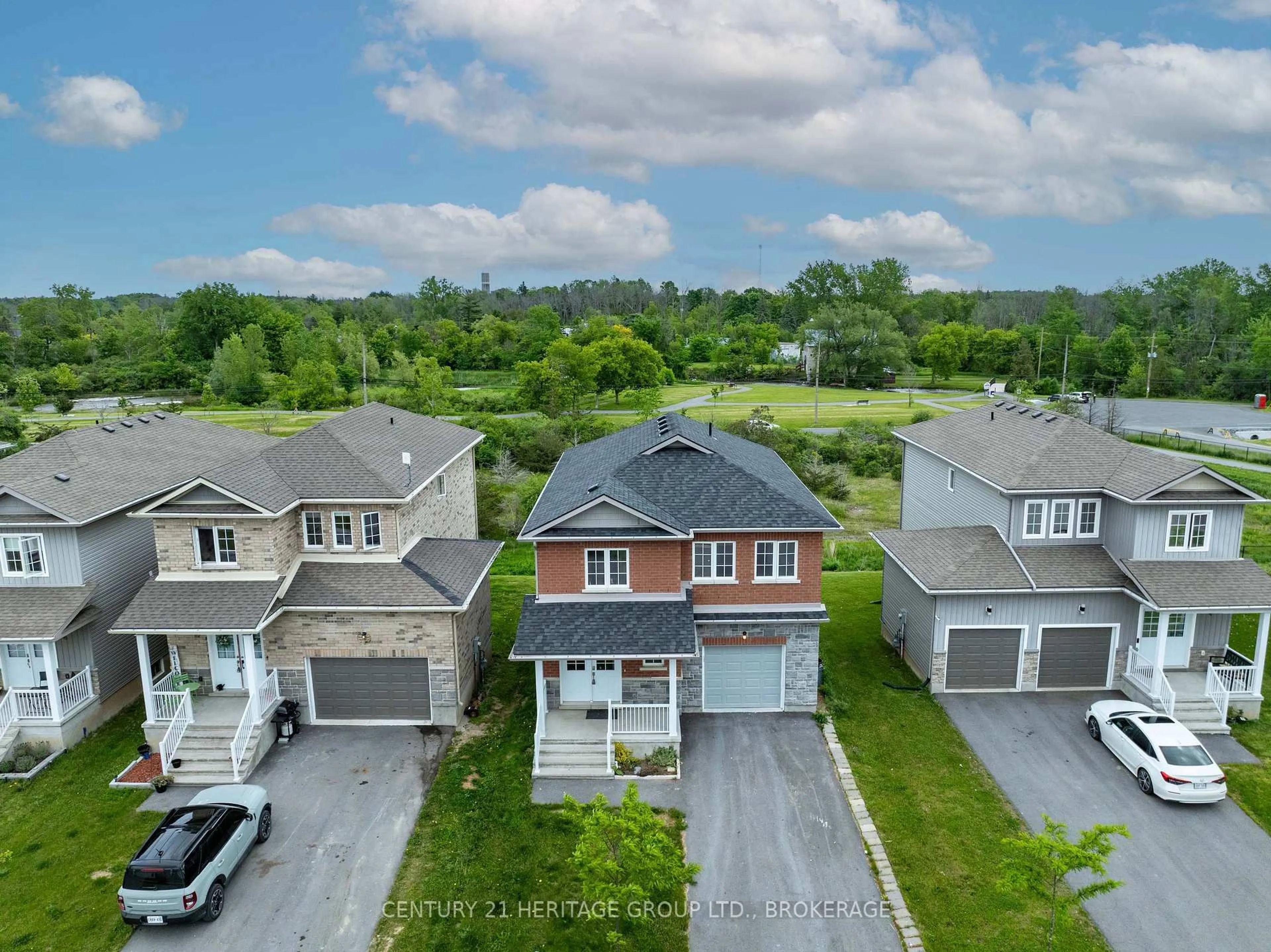A pic from outside/outdoor area/front of a property/back of a property/a pic from drone, street for 104 Brennan Cres, Bissett Creek Ontario K0H 2H0