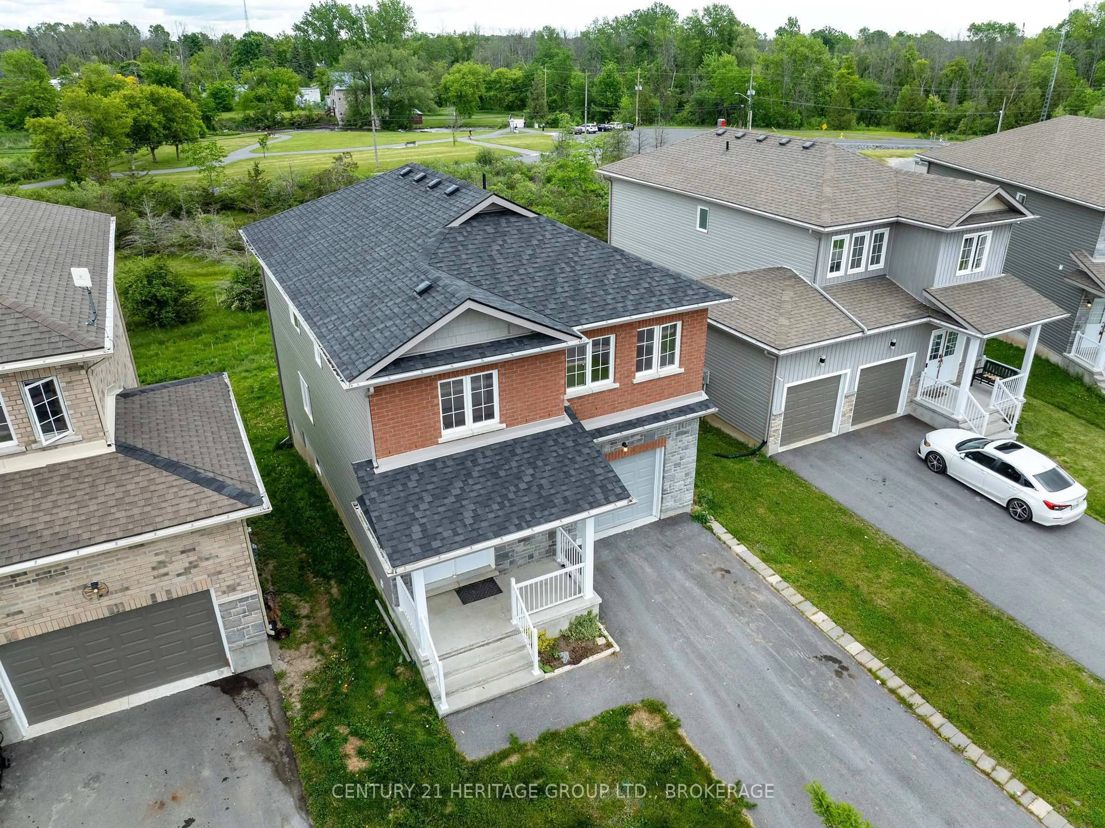 A pic from outside/outdoor area/front of a property/back of a property/a pic from drone, street for 104 Brennan Cres, Bissett Creek Ontario K0H 2H0