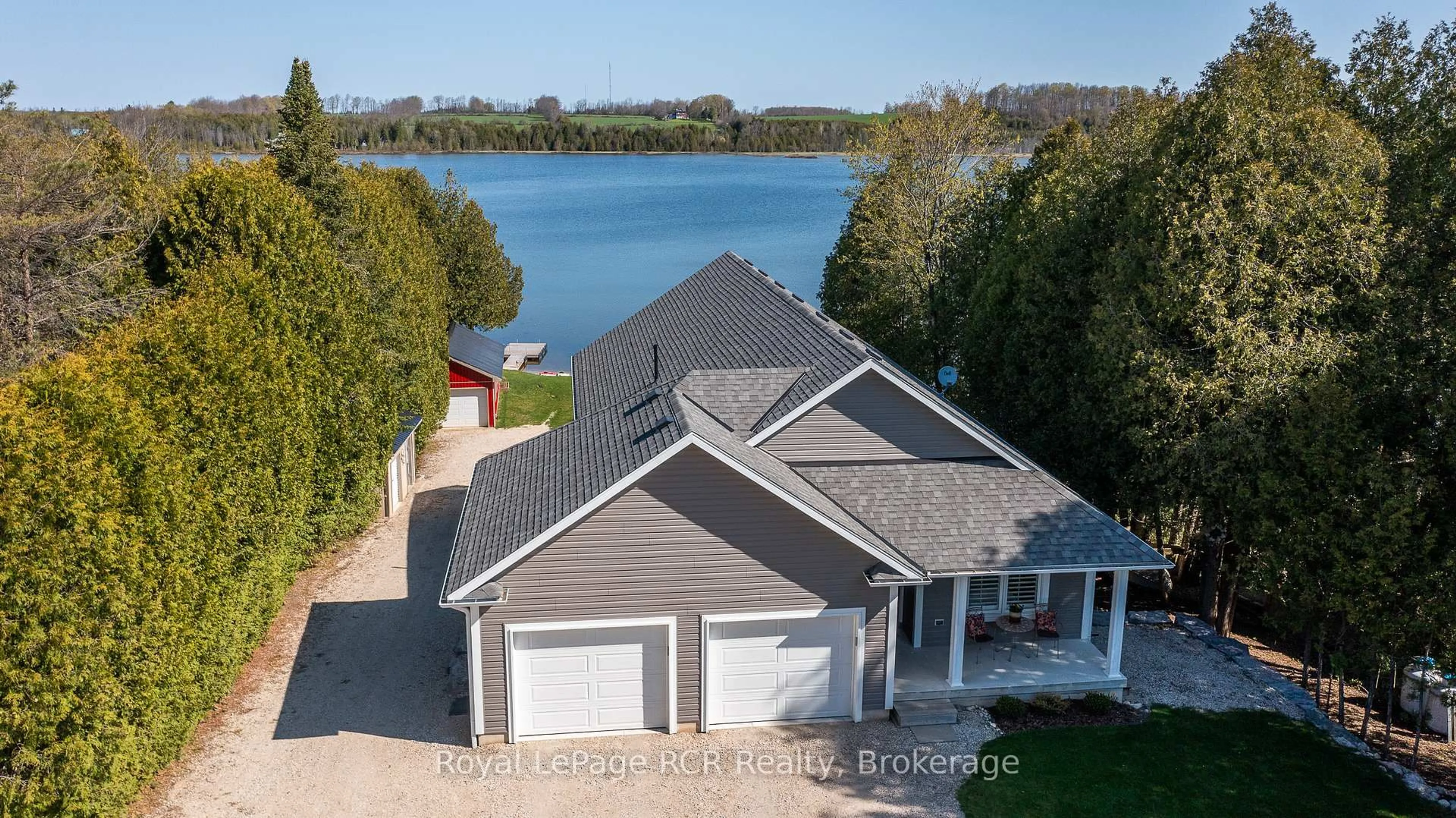 A pic from outside/outdoor area/front of a property/back of a property/a pic from drone, water/lake/river/ocean view for 474825 Townsend Lake Rd, West Grey Ontario N0C 1H0