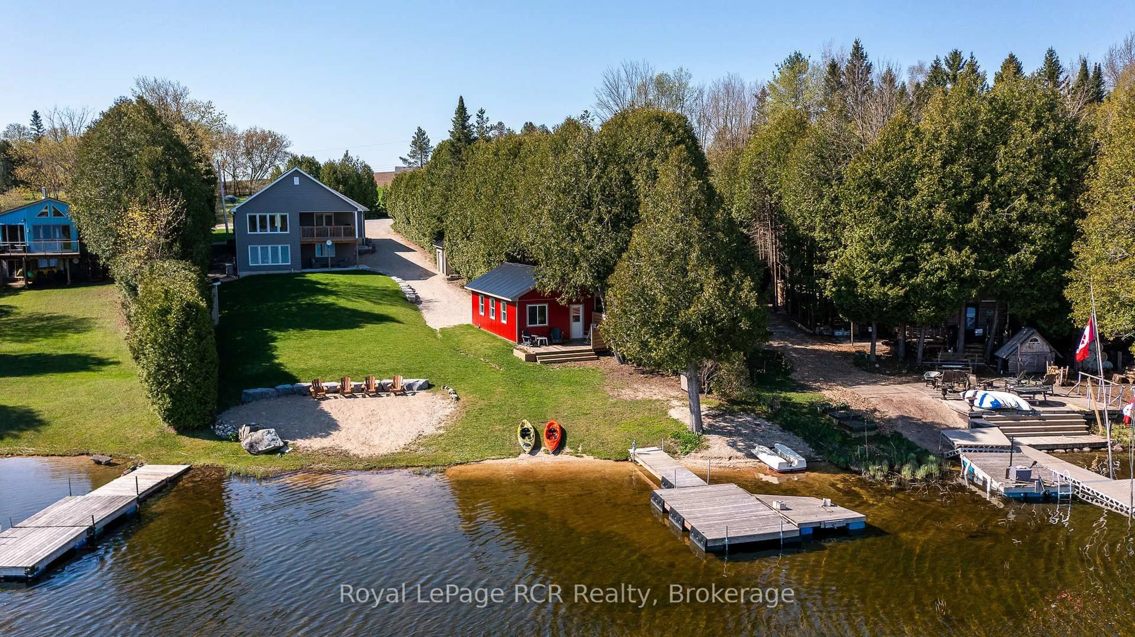 A pic from outside/outdoor area/front of a property/back of a property/a pic from drone, water/lake/river/ocean view for 474825 Townsend Lake Rd, West Grey Ontario N0C 1H0