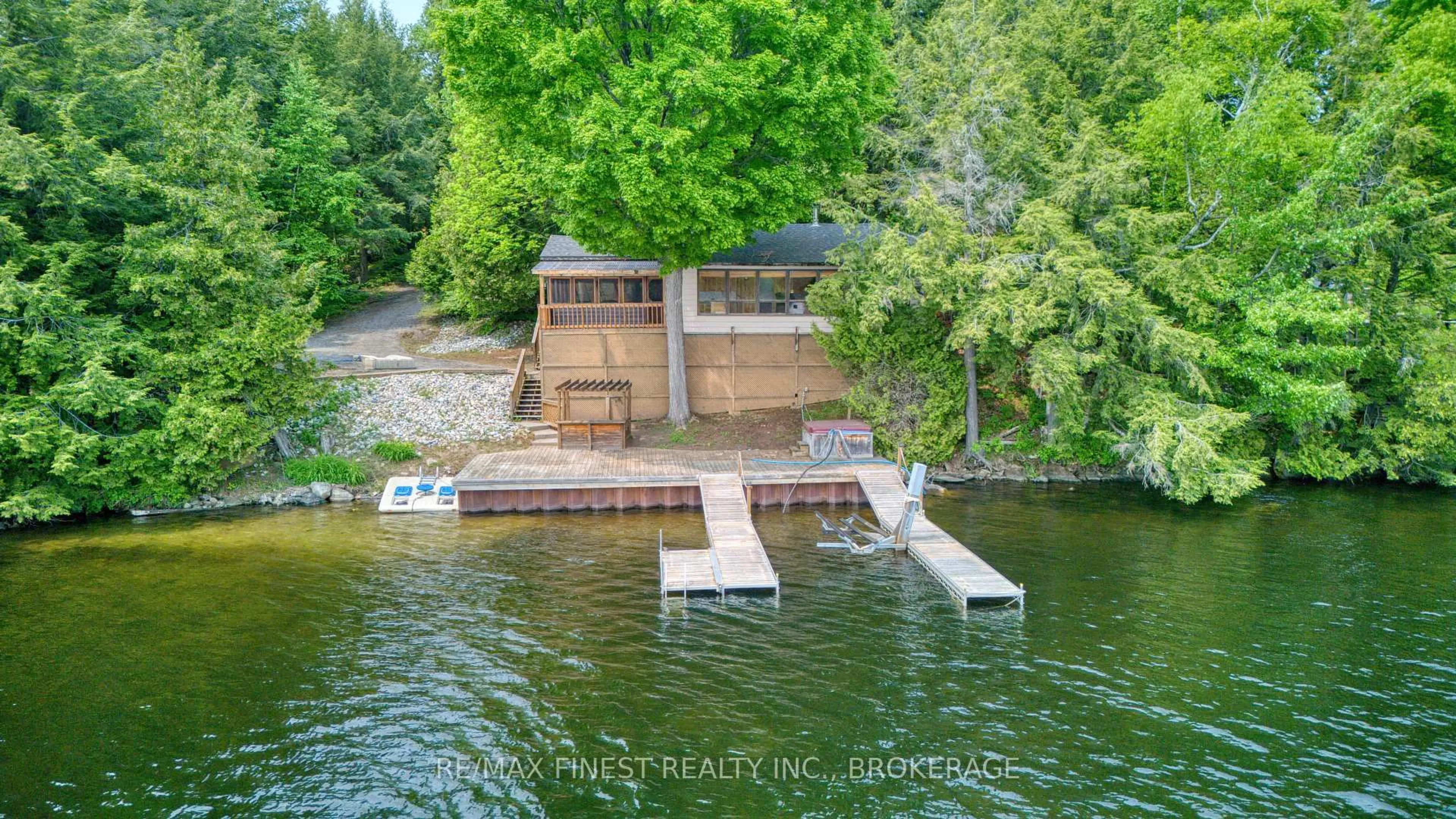 A pic from outside/outdoor area/front of a property/back of a property/a pic from drone, water/lake/river/ocean view for 1140B Point Lane, Sharbot Lake Ontario K0H 2P0