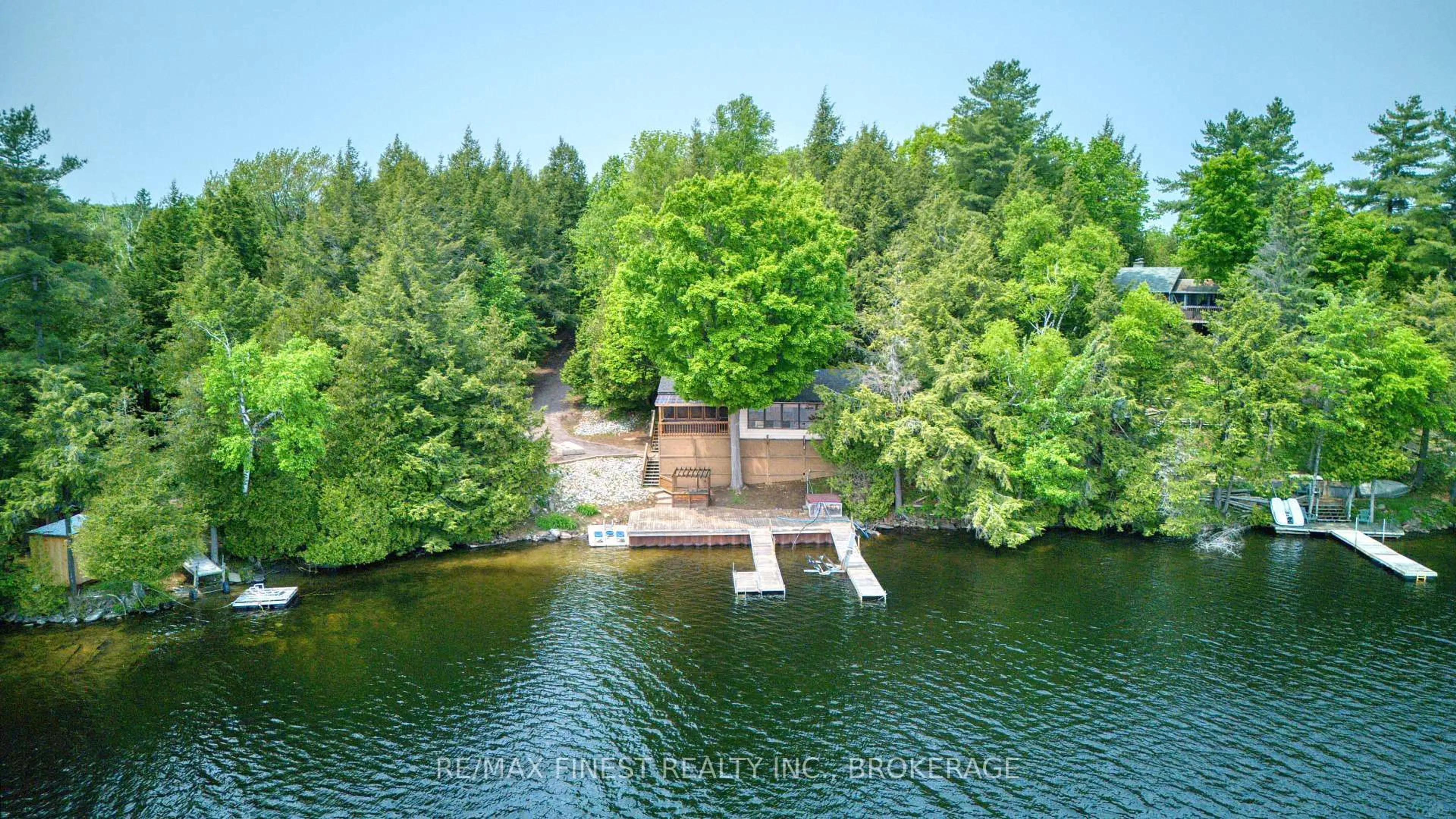 A pic from outside/outdoor area/front of a property/back of a property/a pic from drone, water/lake/river/ocean view for 1140B Point Lane, Sharbot Lake Ontario K0H 2P0