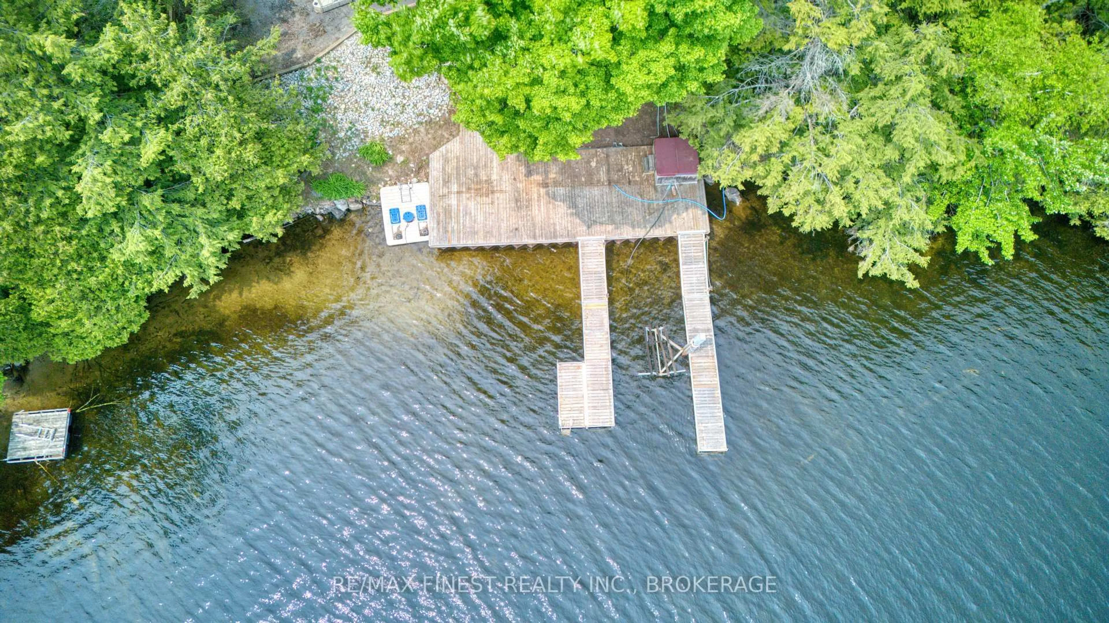 A pic from outside/outdoor area/front of a property/back of a property/a pic from drone, water/lake/river/ocean view for 1140B Point Lane, Sharbot Lake Ontario K0H 2P0