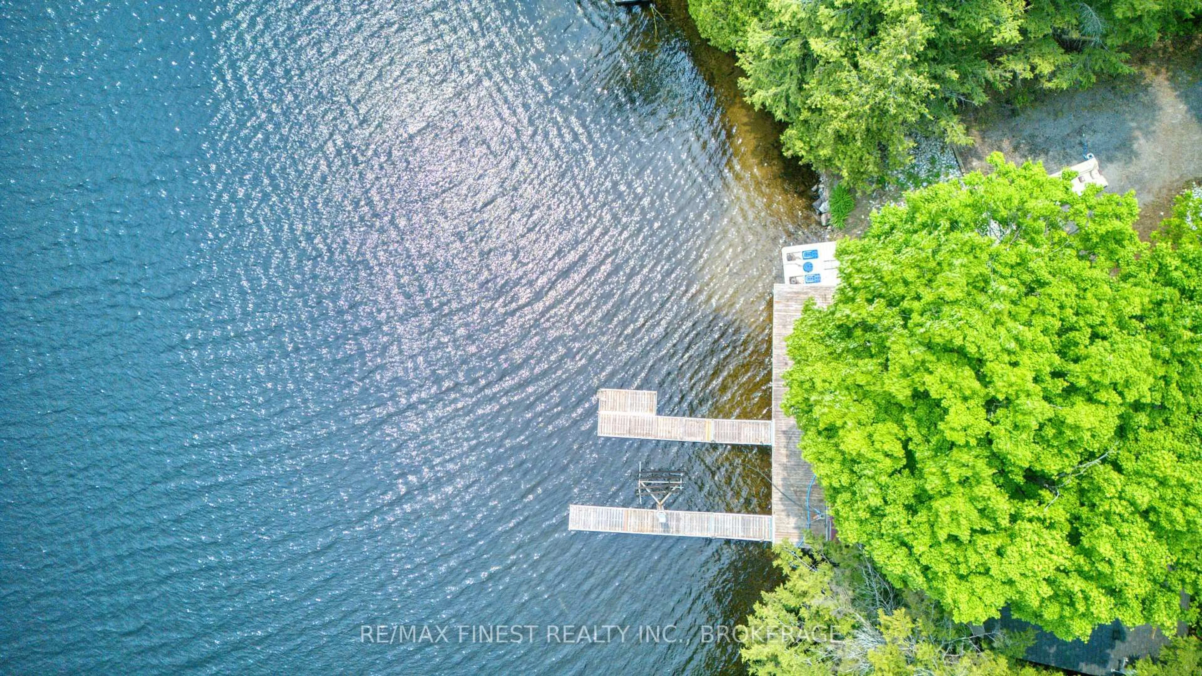 A pic from outside/outdoor area/front of a property/back of a property/a pic from drone, water/lake/river/ocean view for 1140B Point Lane, Sharbot Lake Ontario K0H 2P0