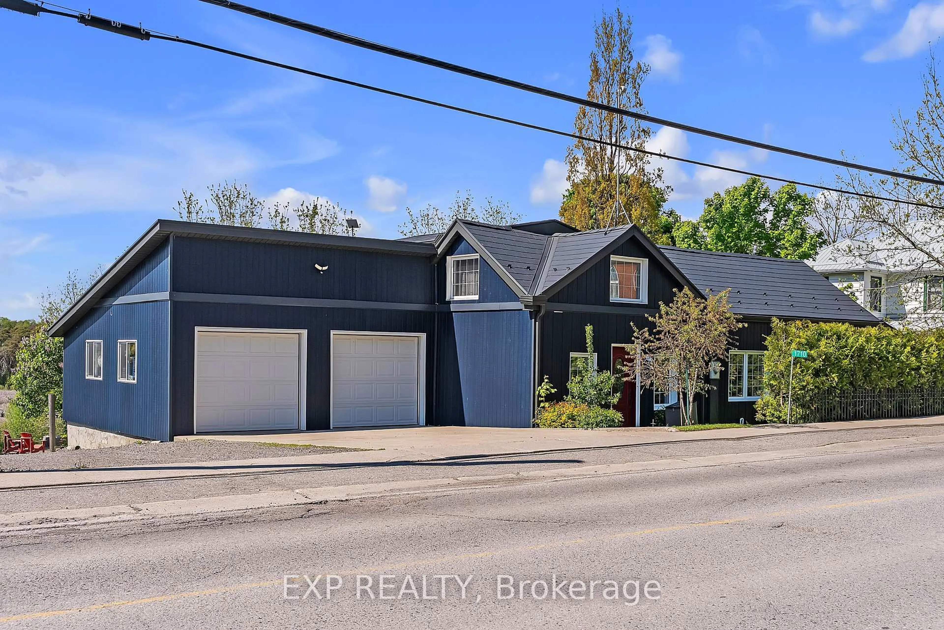 A pic from outside/outdoor area/front of a property/back of a property/a pic from drone, street for 1710 County Road 10, Prince Edward County Ontario K0K 1P0