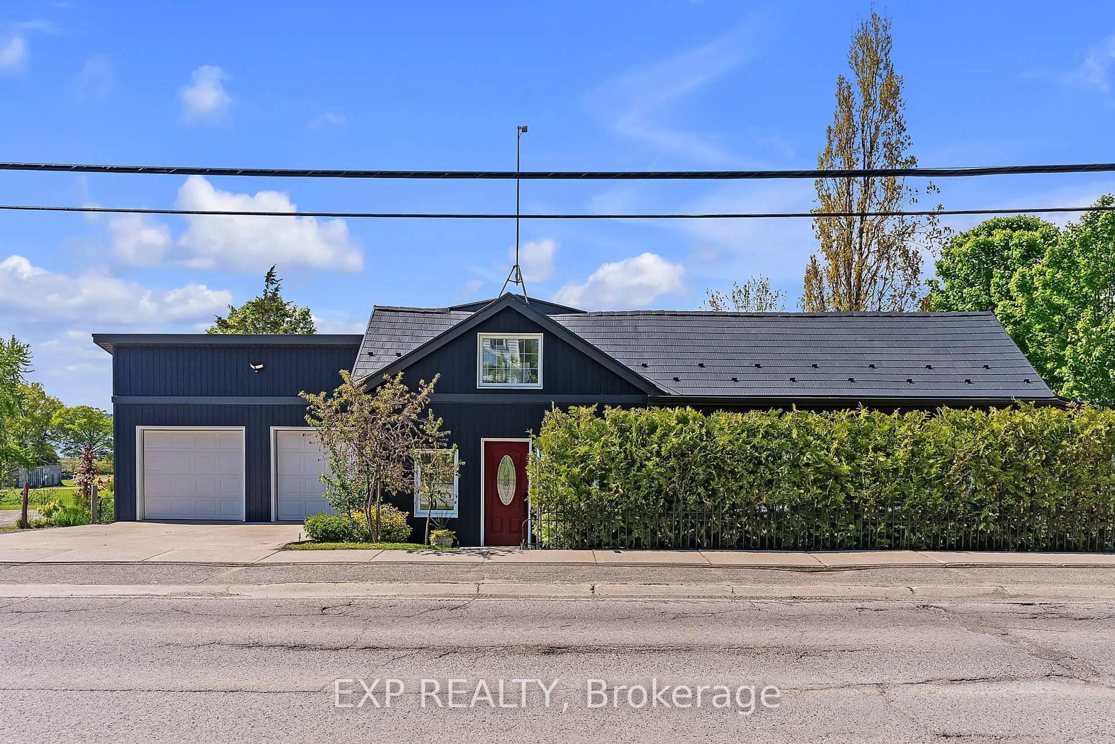 A pic from outside/outdoor area/front of a property/back of a property/a pic from drone, street for 1710 County Road 10, Prince Edward County Ontario K0K 1P0