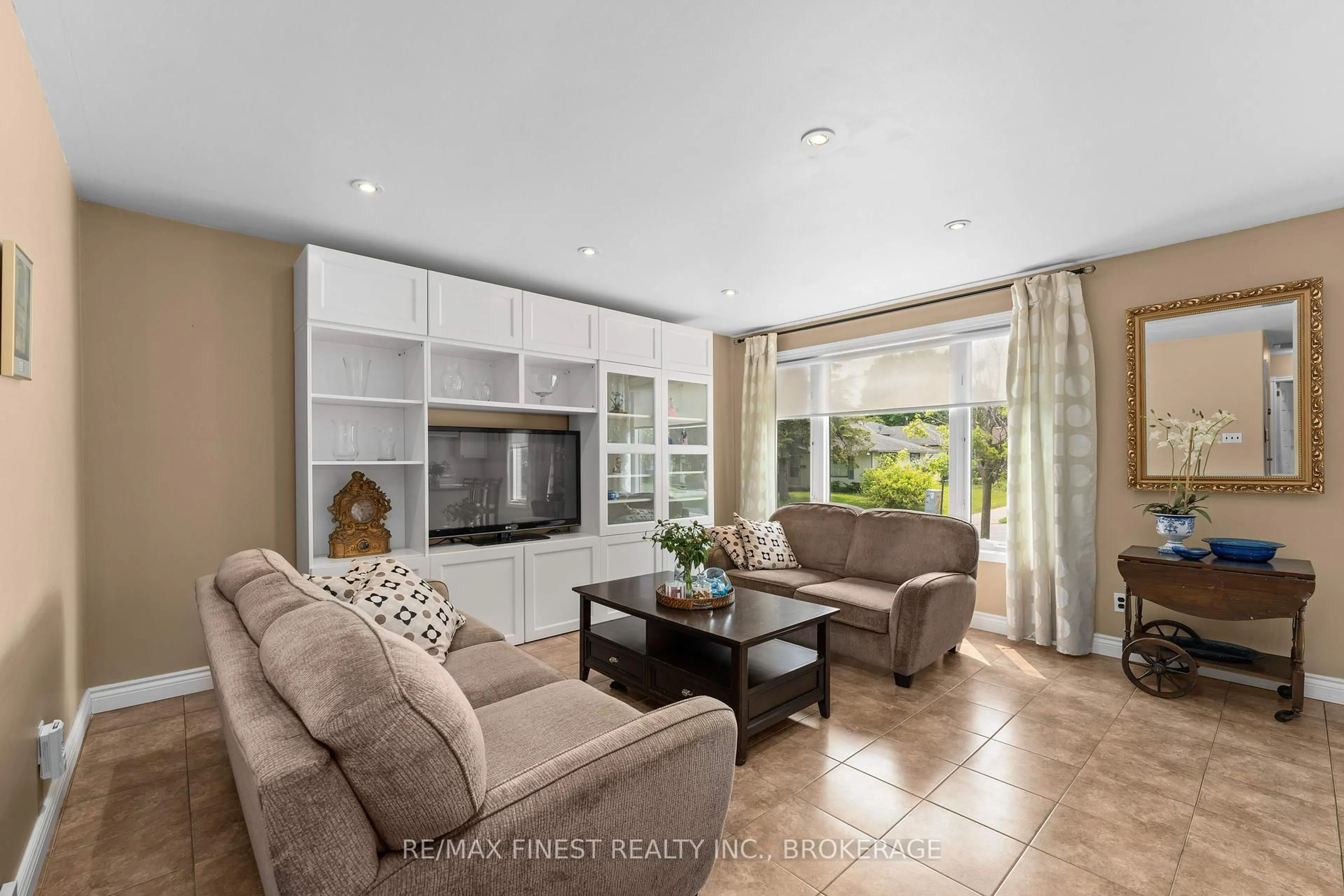 Living room with furniture, ceramic/tile floor for 95 Calderwood Dr, Kingston Ontario K7M 6L5