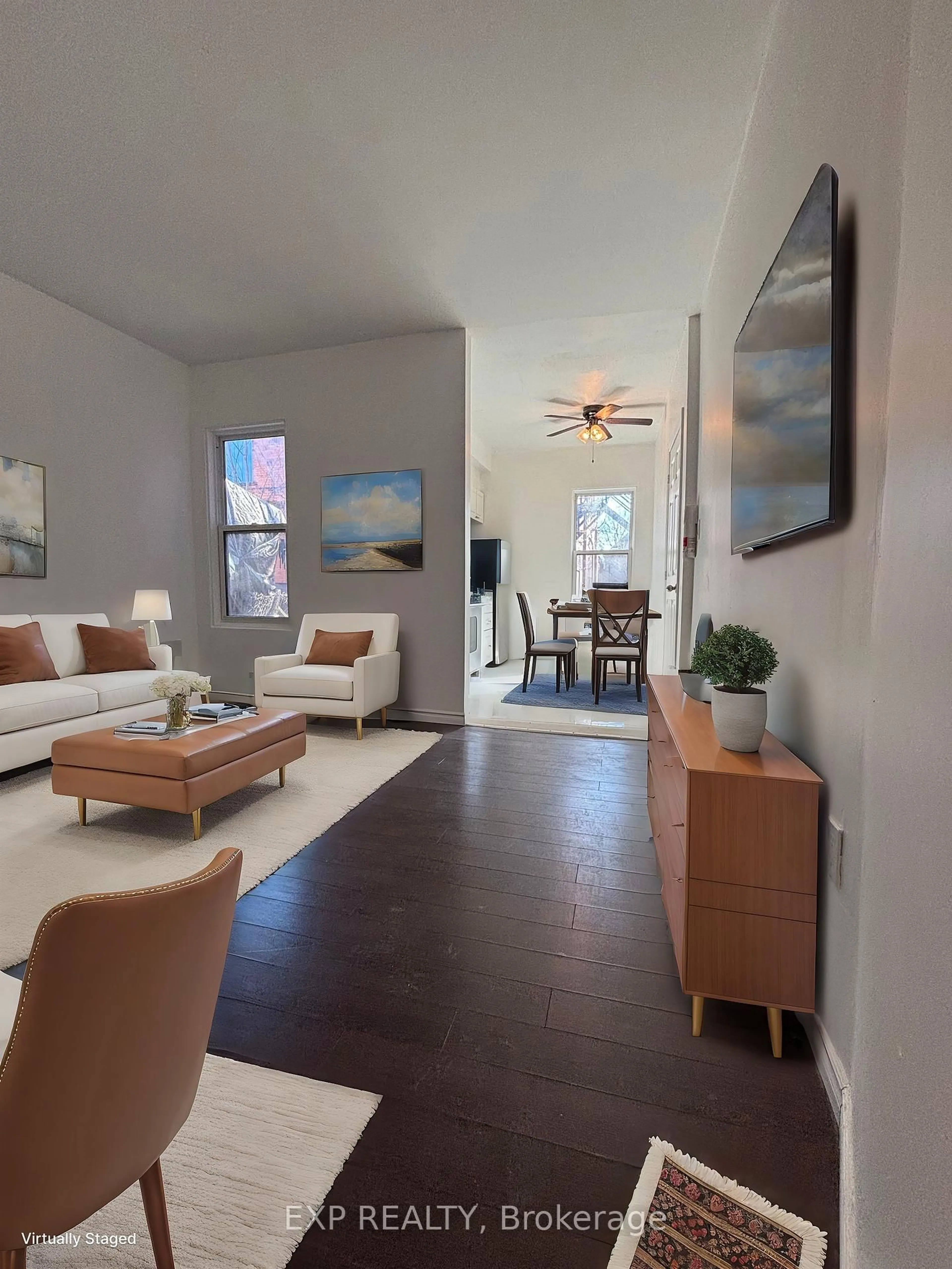 Living room with furniture, wood/laminate floor for 66 Stirton St, Hamilton Ontario L8L 6E9