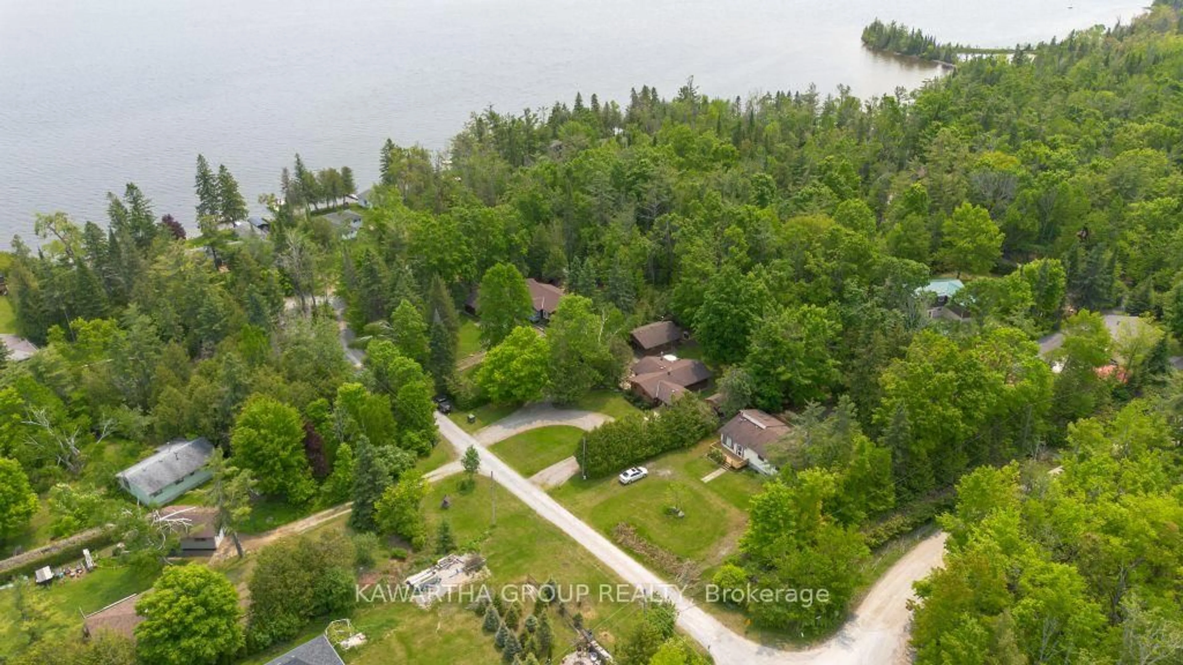 A pic from outside/outdoor area/front of a property/back of a property/a pic from drone, water/lake/river/ocean view for 92 Laidlaw Dr, Kawartha Lakes Ontario K0M 2B0