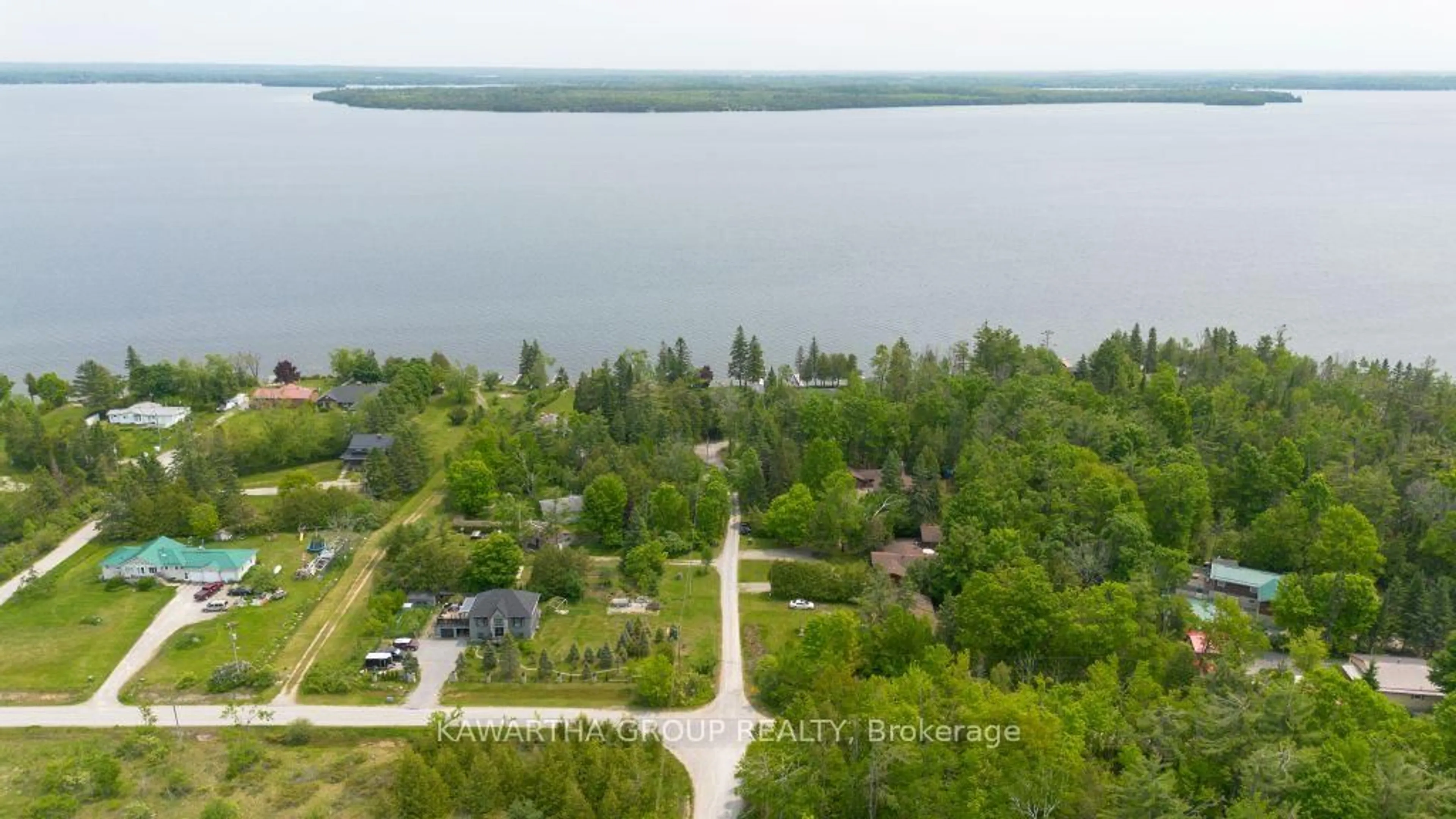 A pic from outside/outdoor area/front of a property/back of a property/a pic from drone, water/lake/river/ocean view for 92 Laidlaw Dr, Kawartha Lakes Ontario K0M 2B0