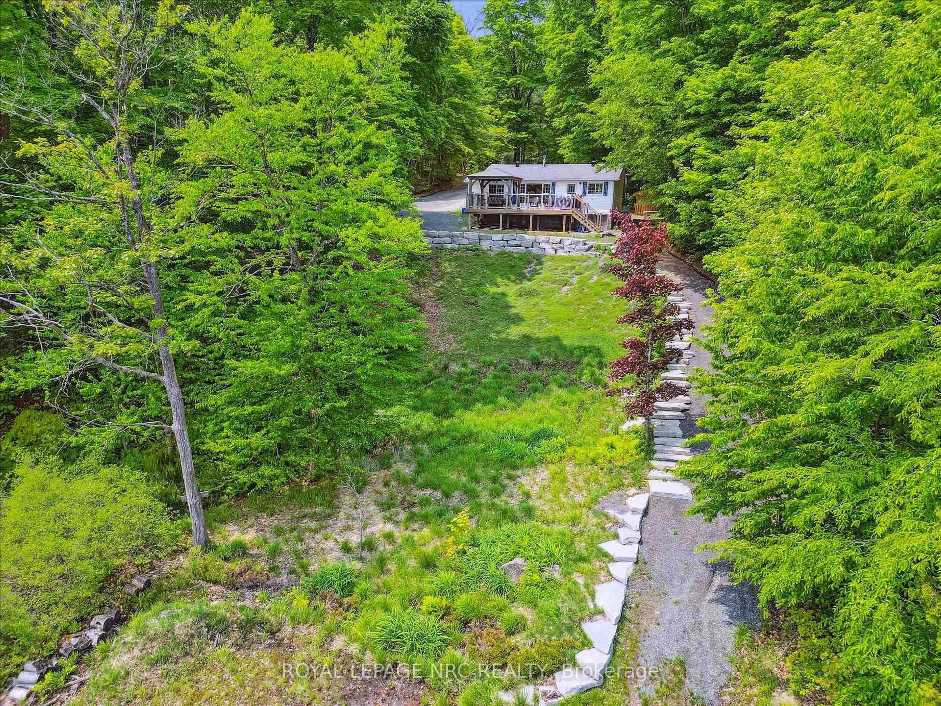 A pic from outside/outdoor area/front of a property/back of a property/a pic from drone, forest/trees view for 283 Salmon Lake Rd, Seguin Ontario P2A 2W8