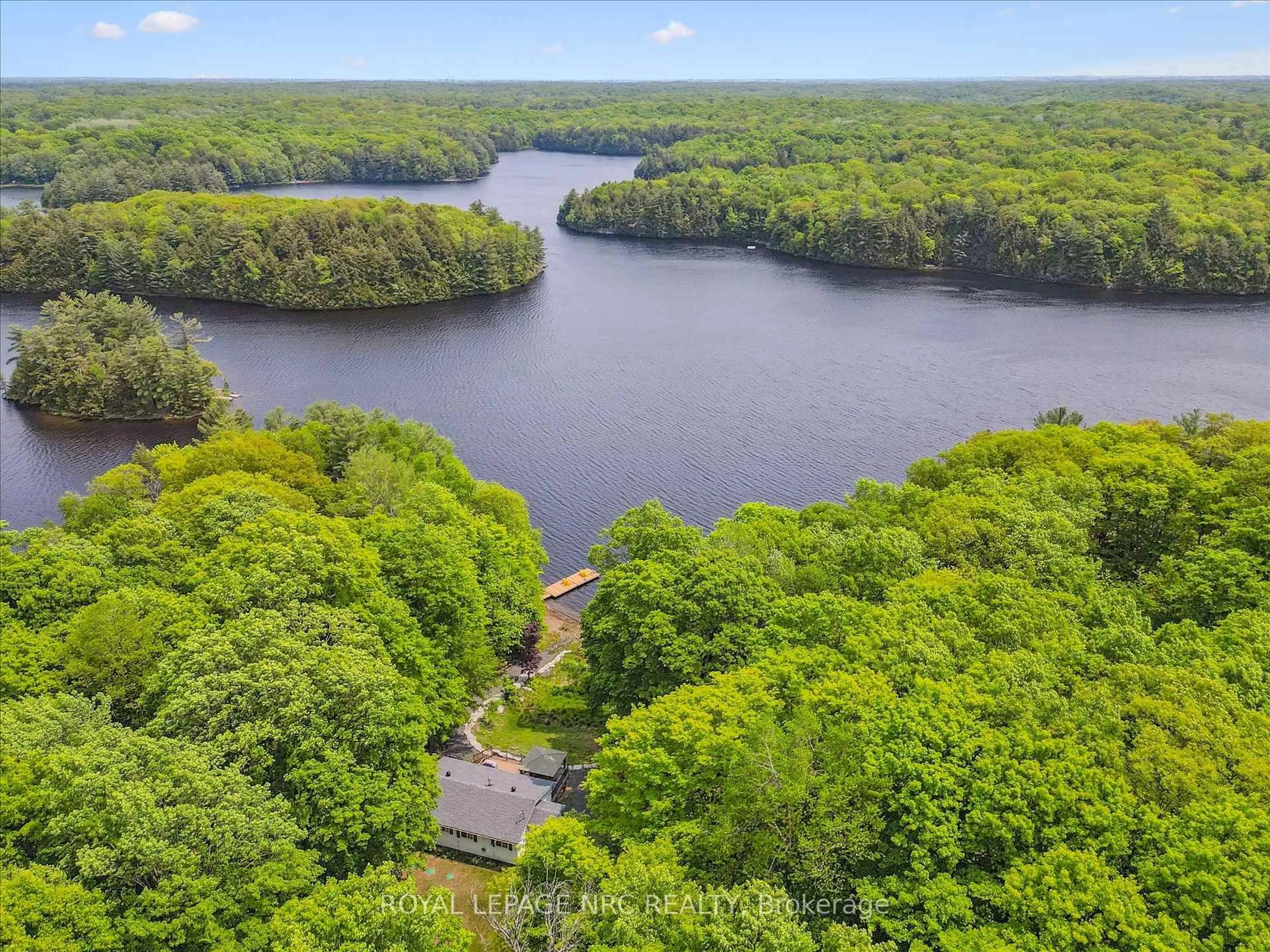A pic from outside/outdoor area/front of a property/back of a property/a pic from drone, water/lake/river/ocean view for 283 Salmon Lake Rd, Seguin Ontario P2A 2W8
