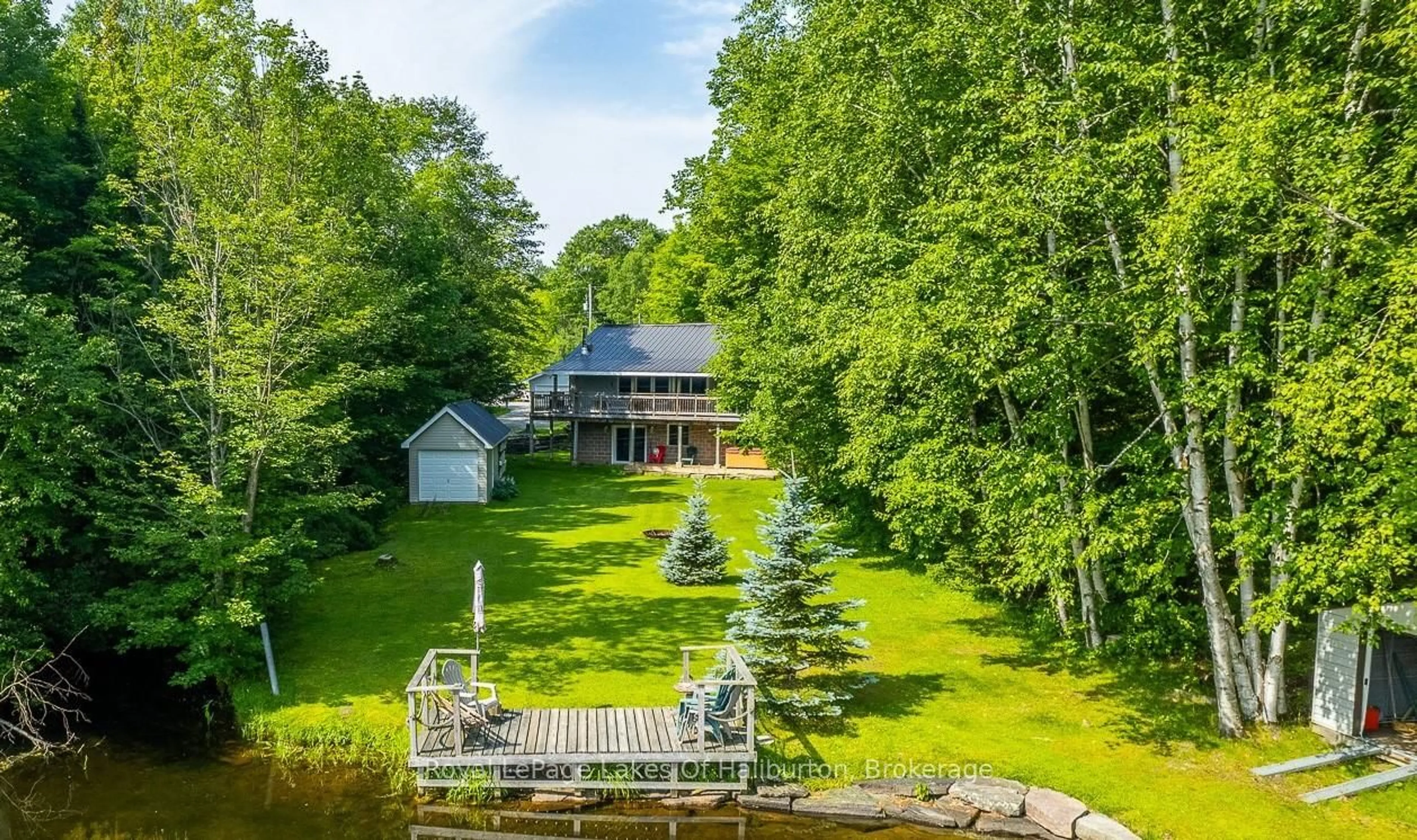 A pic from outside/outdoor area/front of a property/back of a property/a pic from drone, water/lake/river/ocean view for 1272 Little Bob Lake Rd, Minden Hills Ontario K0M 2K0