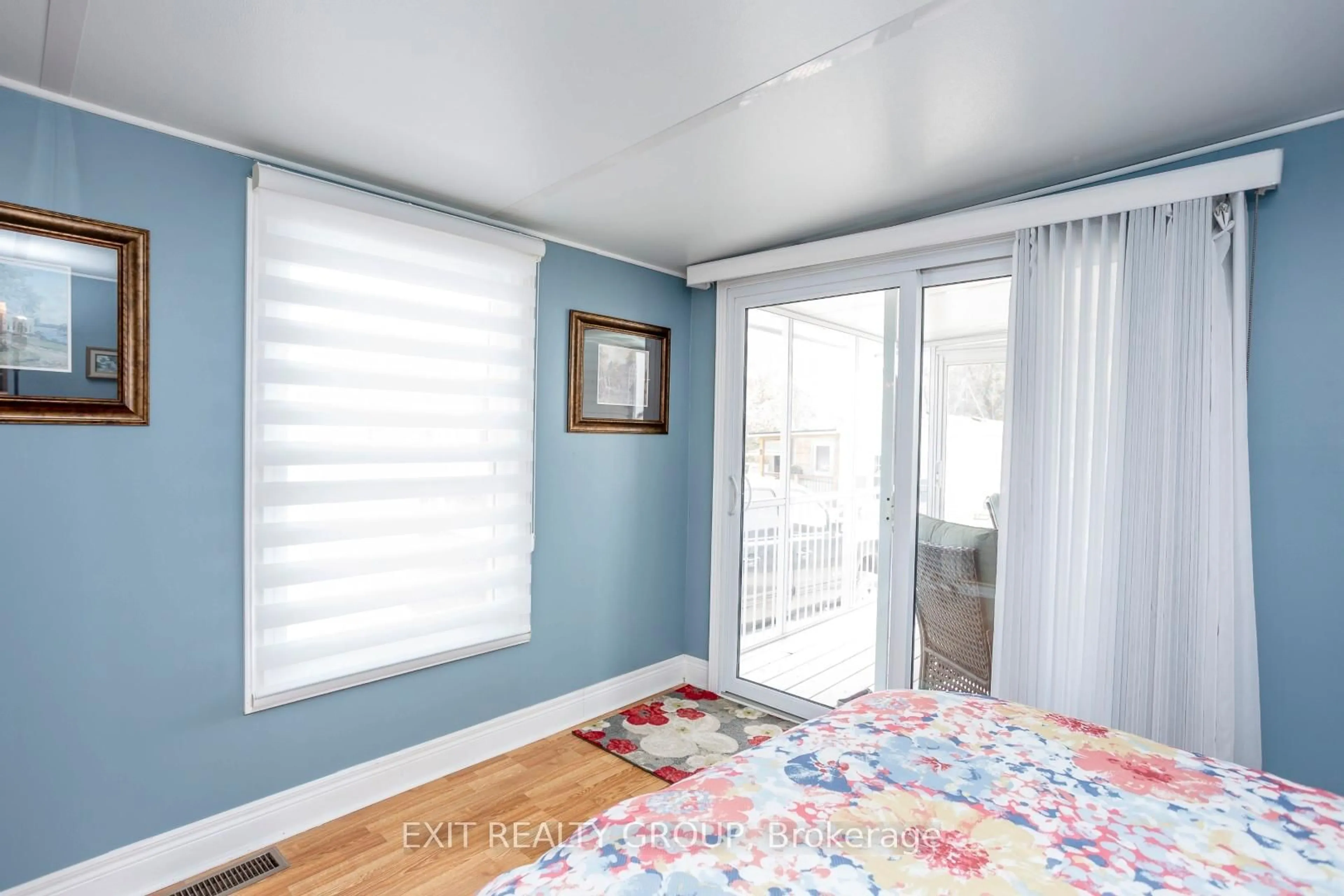 Bedroom with bed, wood/laminate floor for 3 Dale Ave, Prince Edward County Ontario K0K 1T0