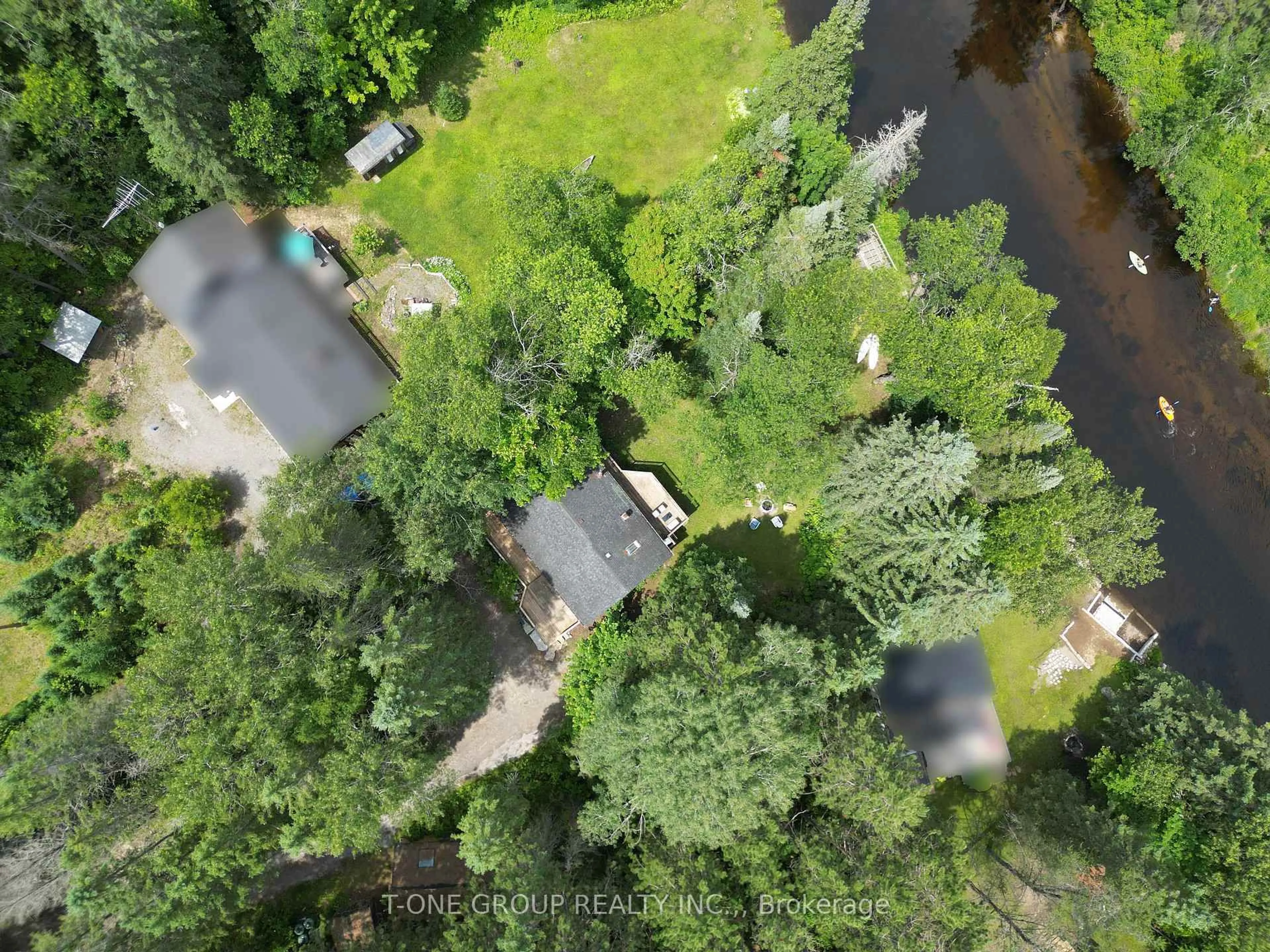 A pic from outside/outdoor area/front of a property/back of a property/a pic from drone, forest/trees view for 10 Riverside Crt, Bancroft Ontario K0L 1C0
