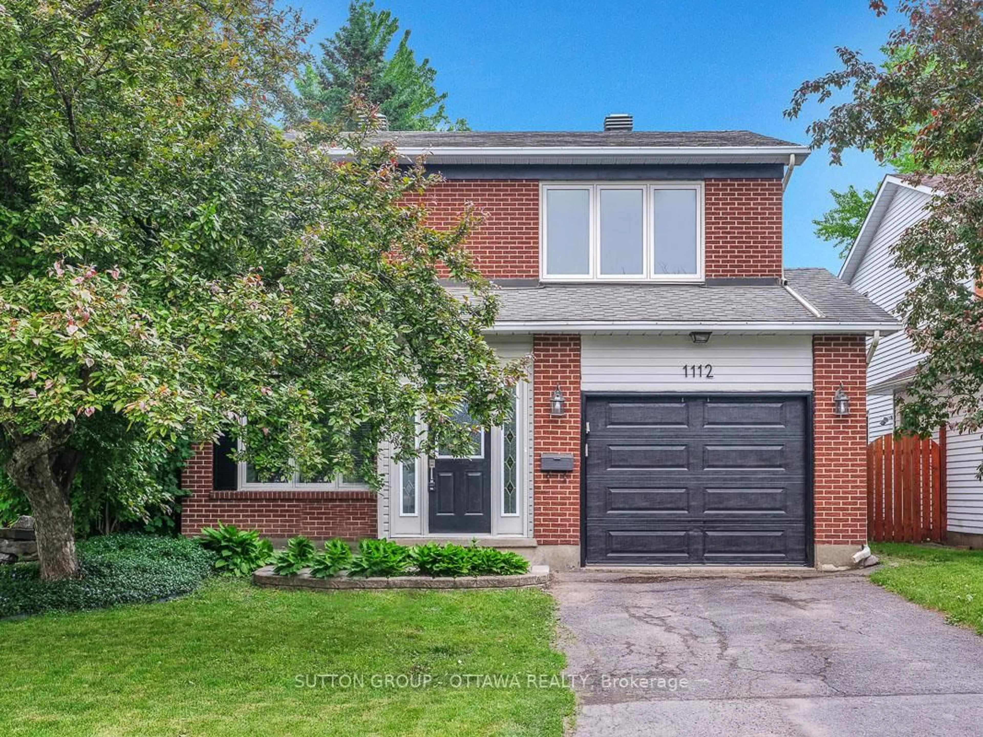 Home with brick exterior material, street for 1112 St. Germain Cres, Ottawa Ontario K1C 2L8