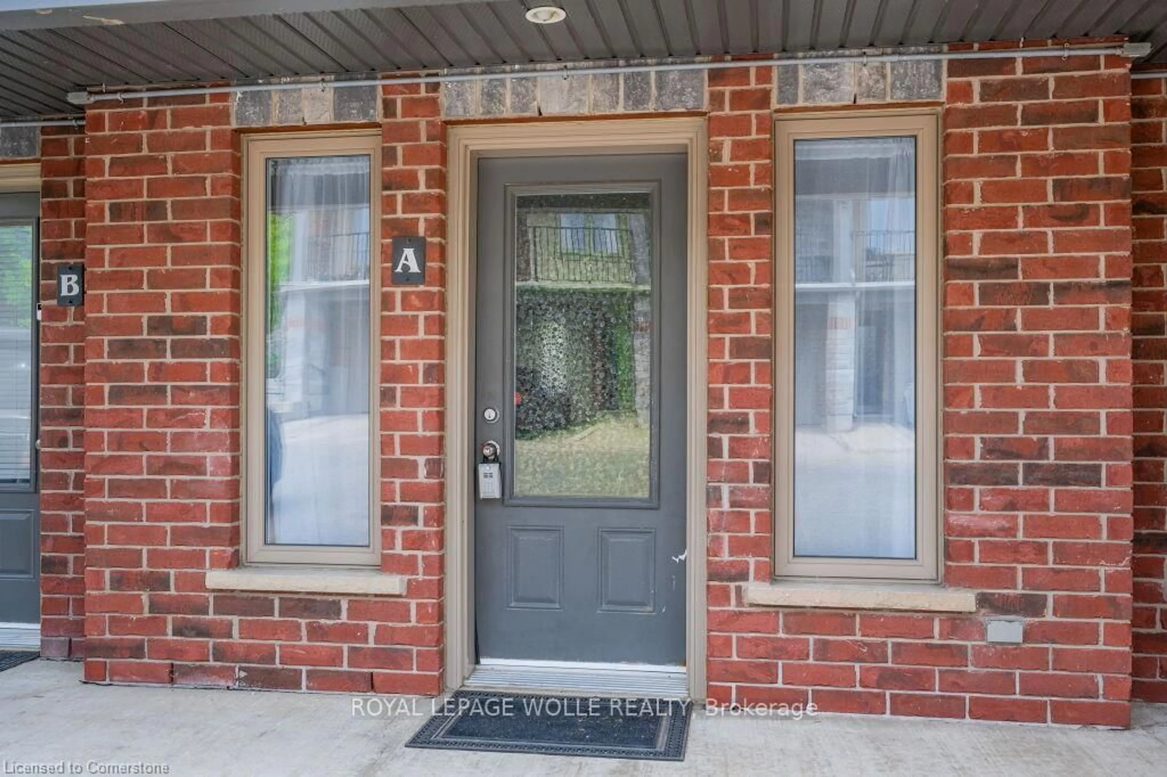 Home with brick exterior material, street for 489 EAST Ave #A, Kitchener Ontario N2H 1Z7