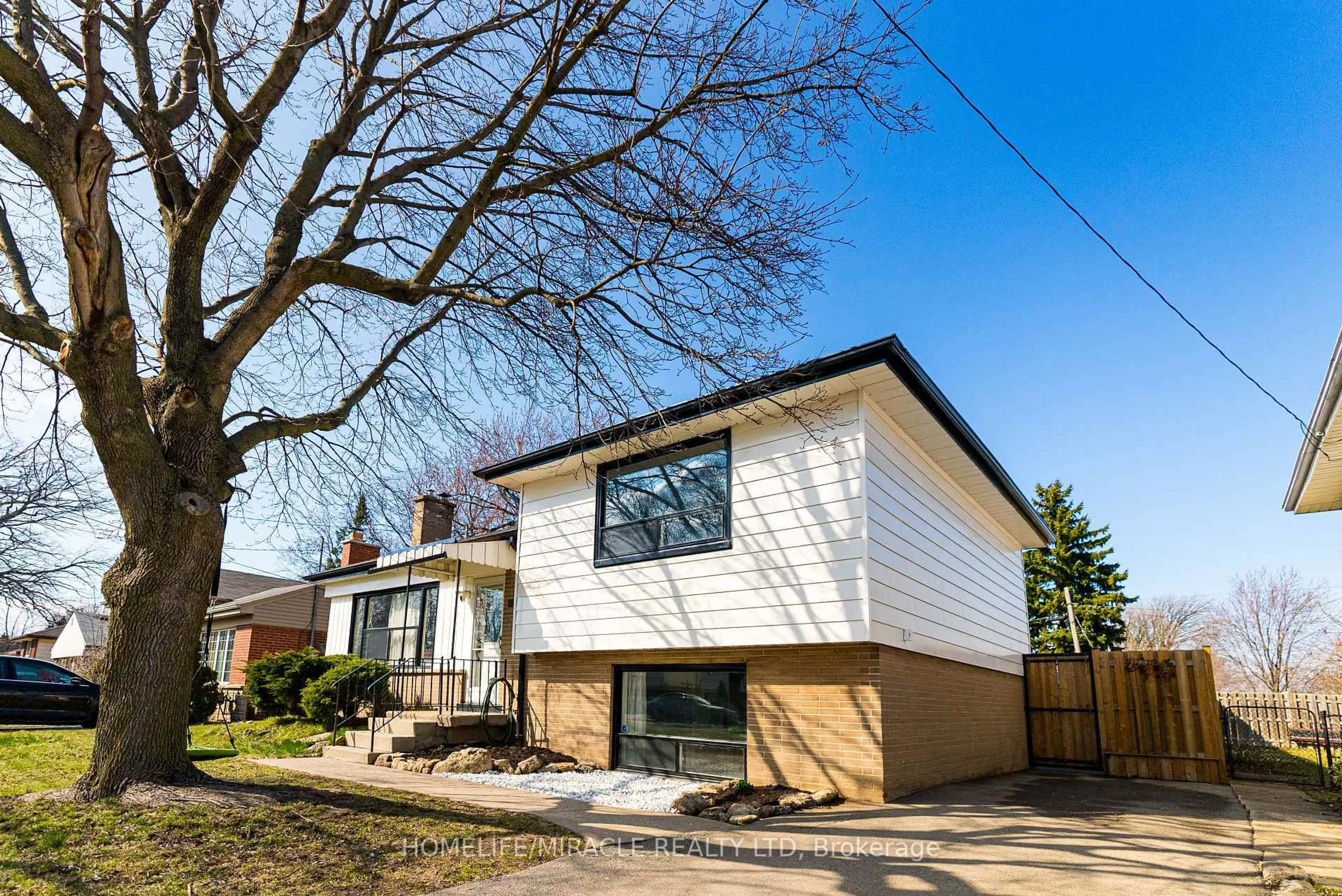 Home with brick exterior material, street for 1013 Brucedale Ave, Hamilton Ontario L8T 1M6