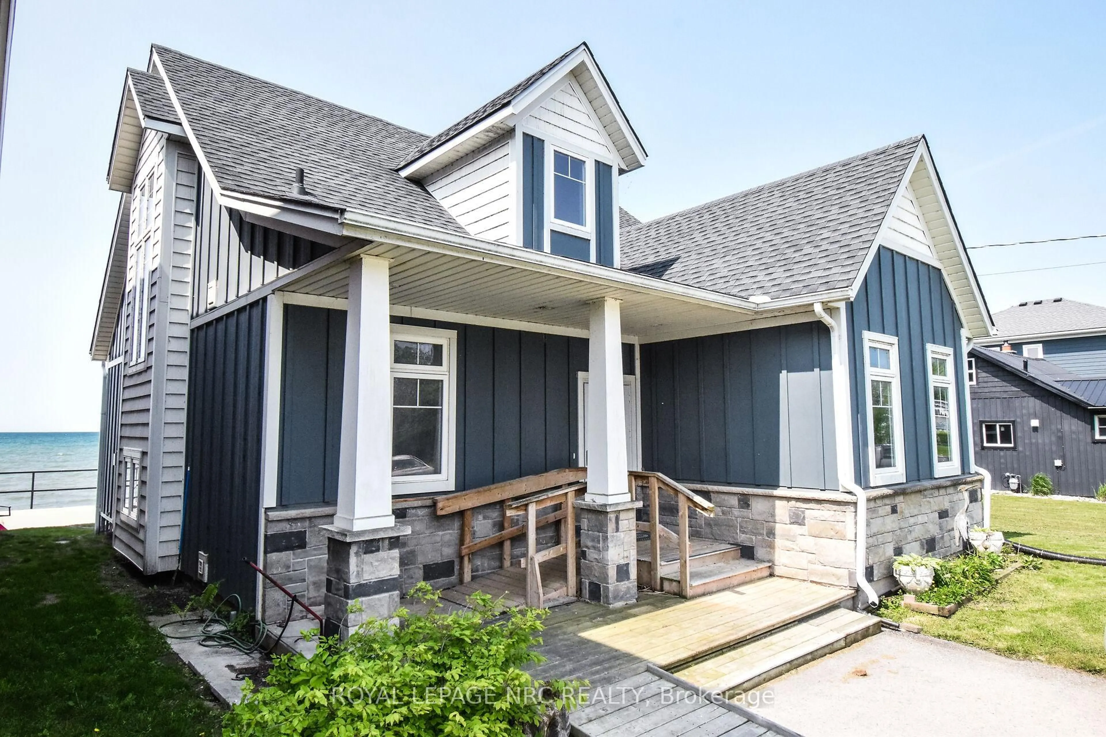 Home with vinyl exterior material, street for 11561 Beach Rd, Wainfleet Ontario L0S 1V0