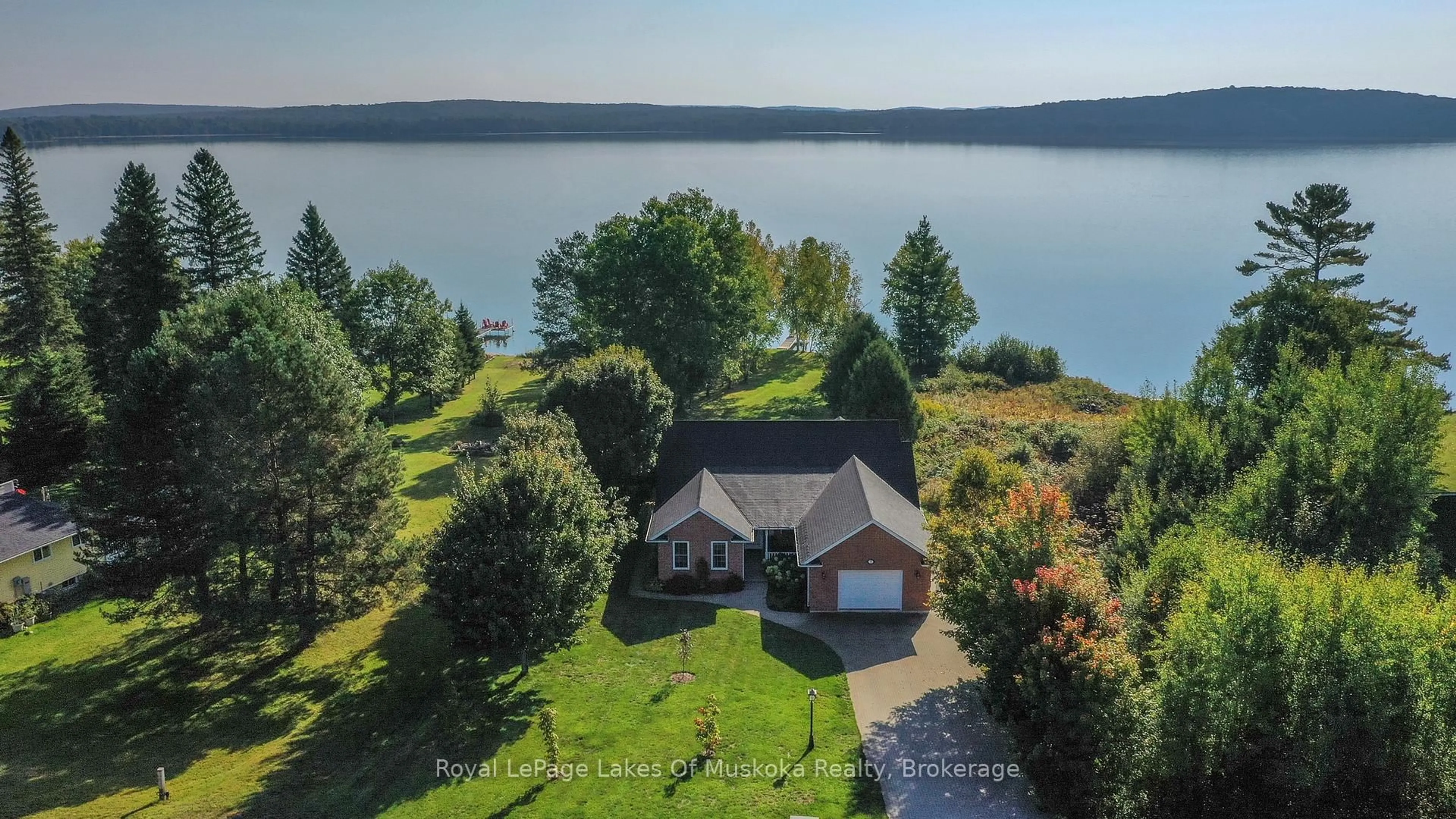 A pic from outside/outdoor area/front of a property/back of a property/a pic from drone, water/lake/river/ocean view for 7 Lake Bernard Dr, Sundridge Ontario P0A 1Z0