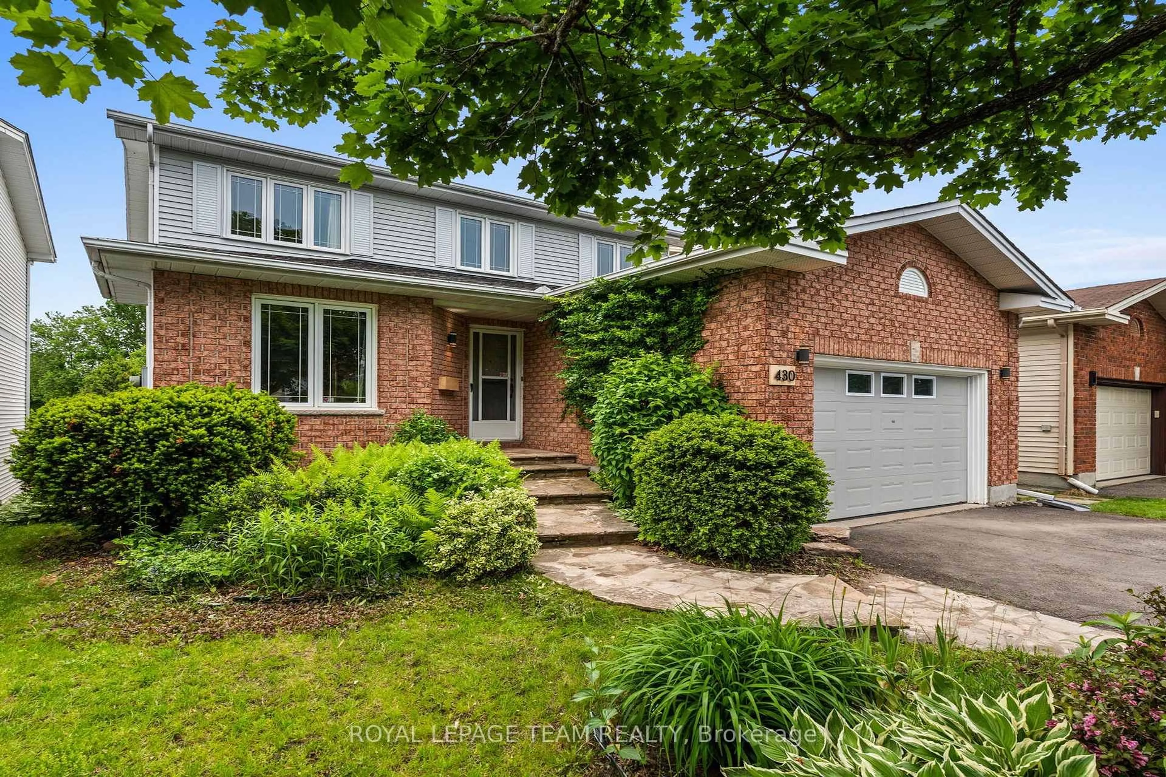 Home with brick exterior material, street for 430 Pauline Charron Pl, Ottawa Ontario K1L 8L4