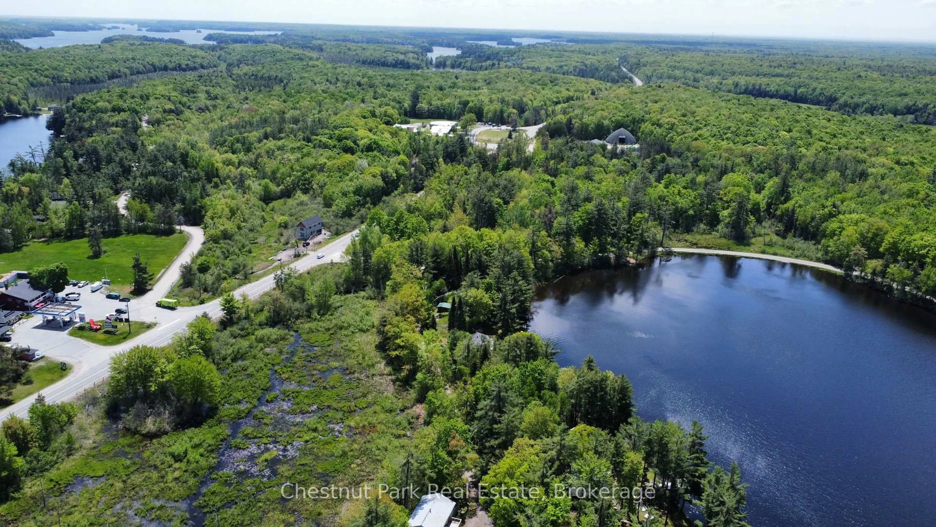 A pic from outside/outdoor area/front of a property/back of a property/a pic from drone, water/lake/river/ocean view for 3980 MUSKOKA RD 169, Muskoka Lakes Ontario P0B 1J0