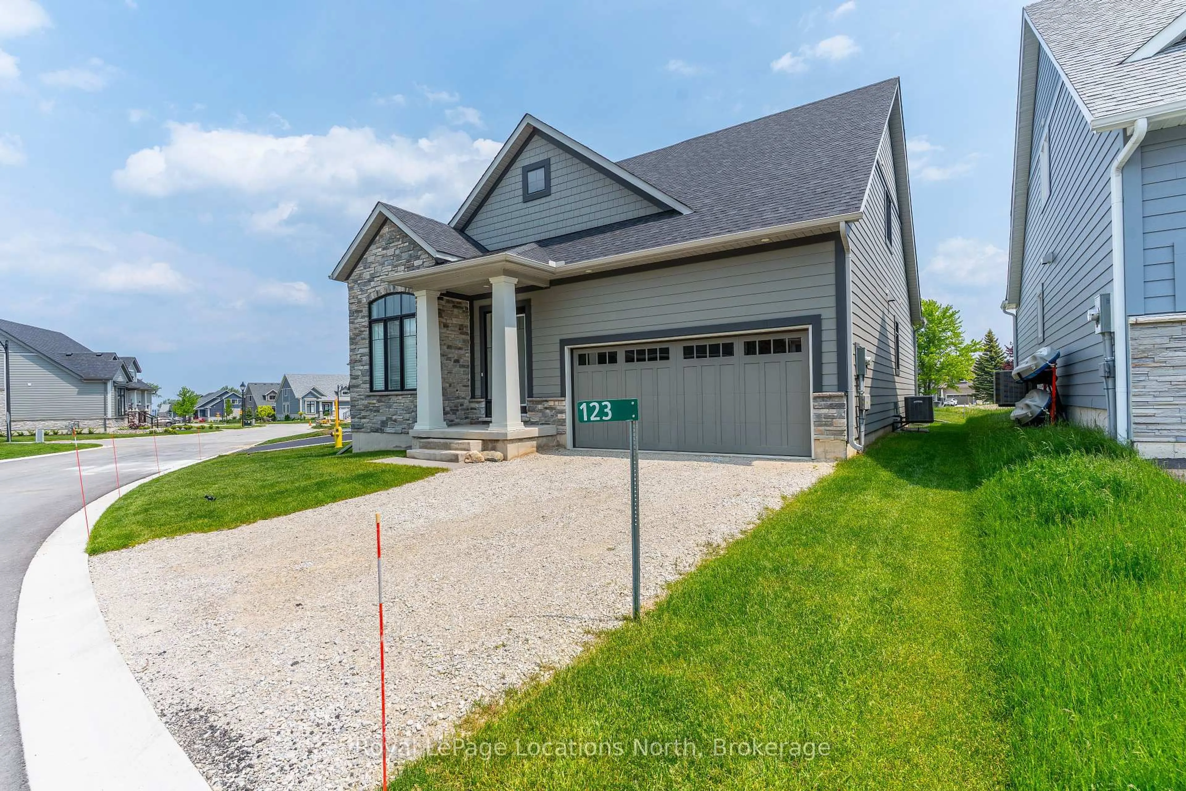 Home with brick exterior material, street for 123 Beacon Dr, Blue Mountains Ontario N0H 2P0
