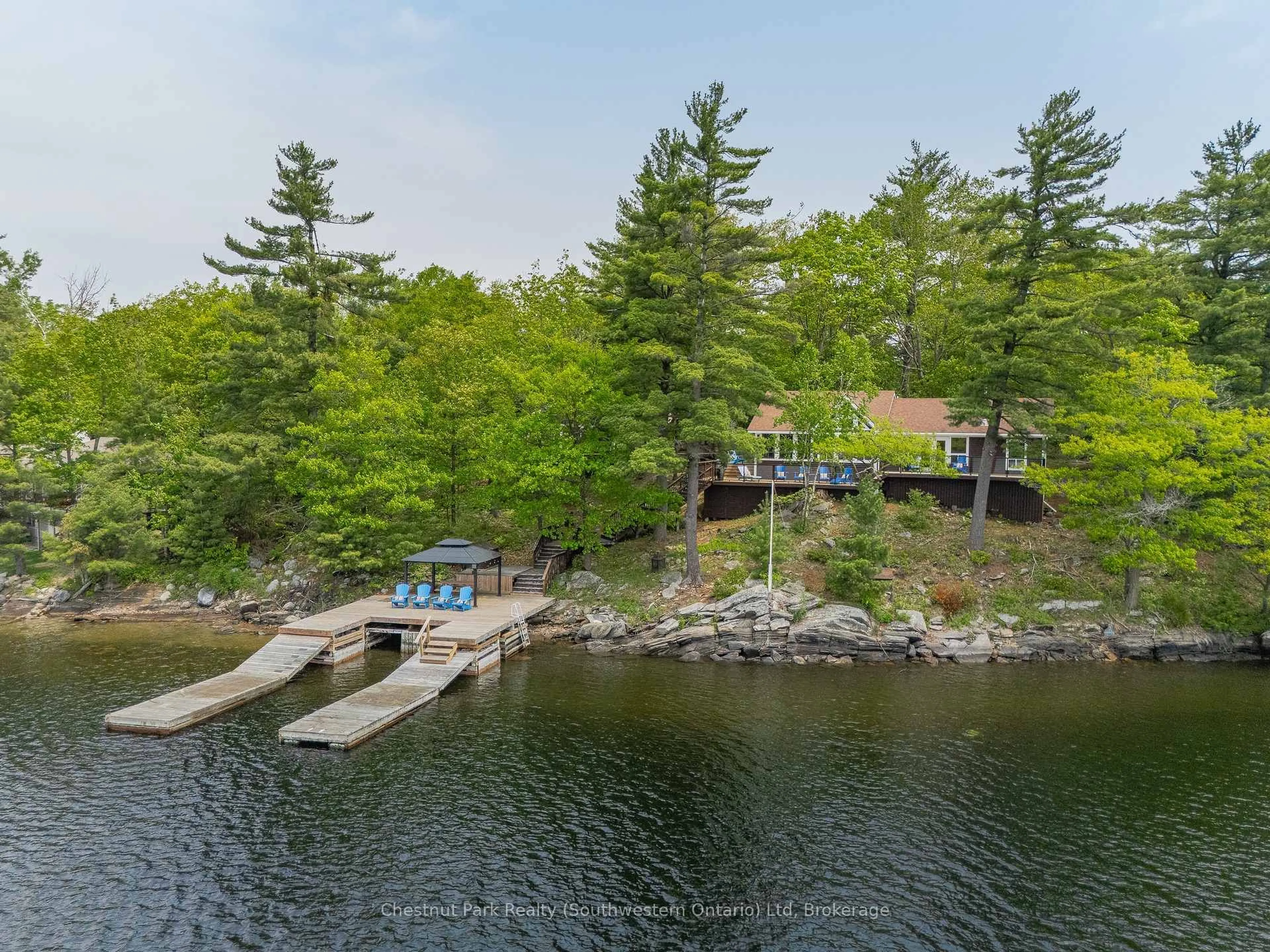 A pic from outside/outdoor area/front of a property/back of a property/a pic from drone, water/lake/river/ocean view for 1953 Harrison Tr, Georgian Bay Ontario P0C 1H0