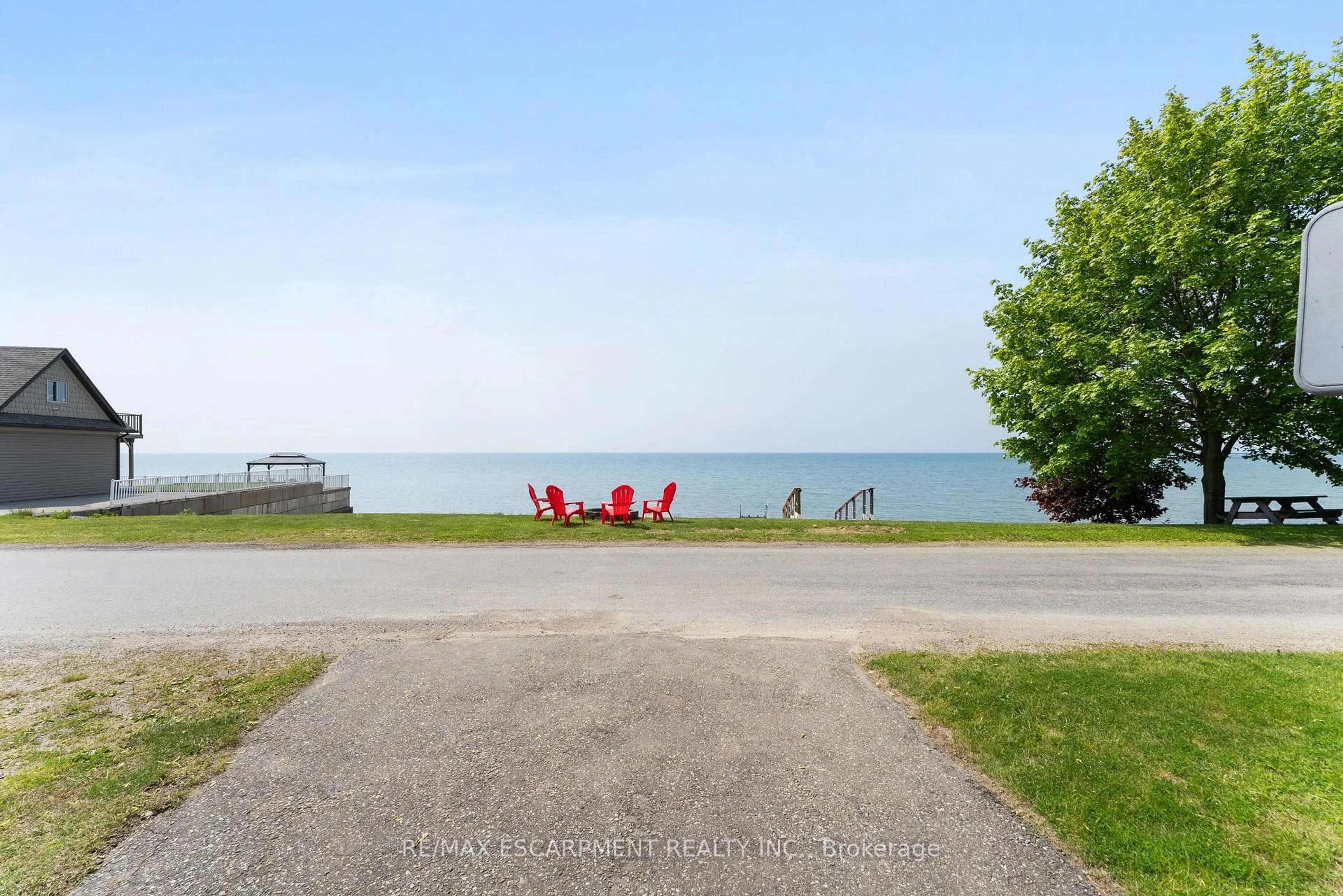 A pic from outside/outdoor area/front of a property/back of a property/a pic from drone, water/lake/river/ocean view for 1351 LAKESHORE Rd, Haldimand Ontario N0A 1P0
