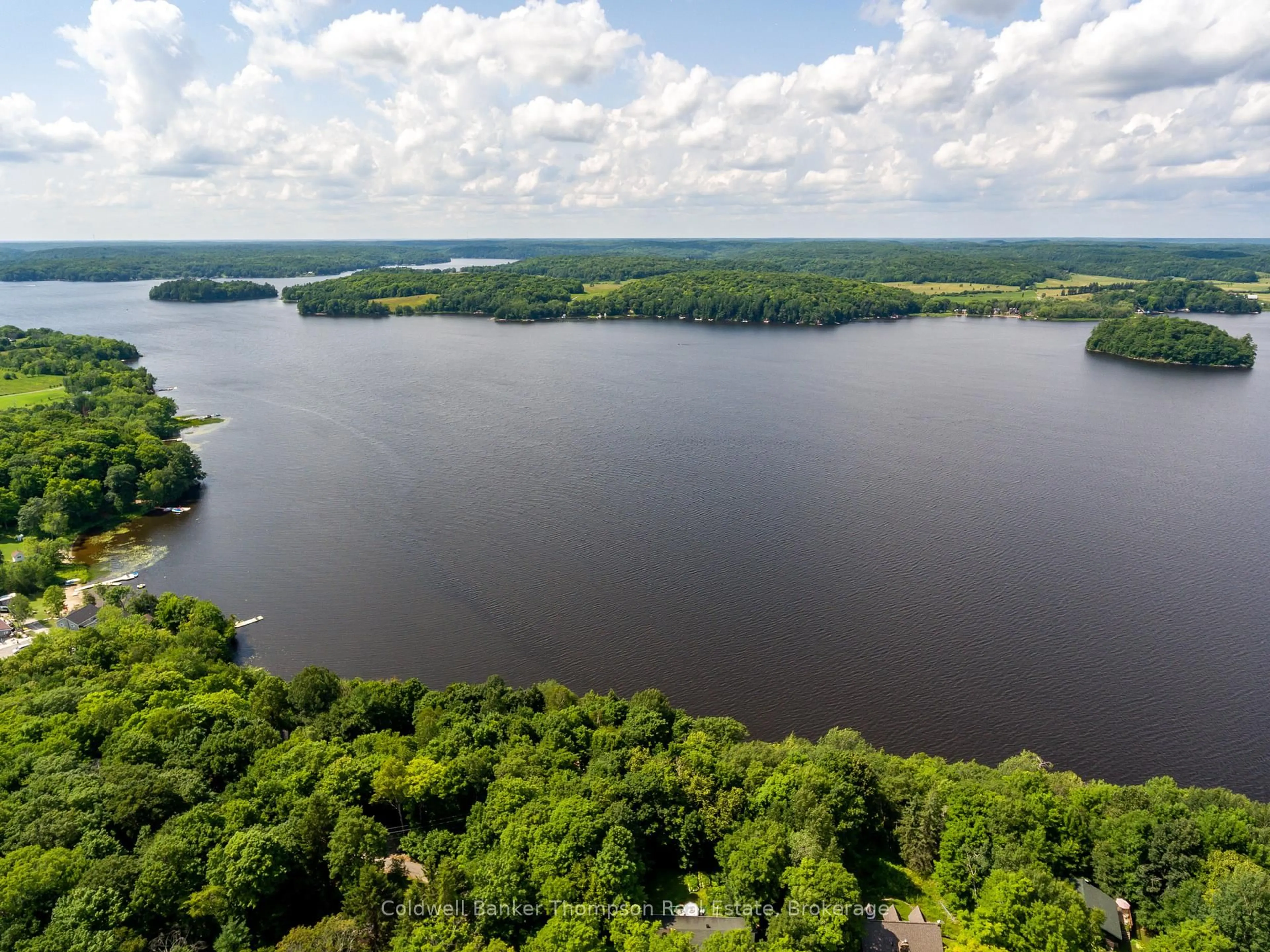 A pic from outside/outdoor area/front of a property/back of a property/a pic from drone, water/lake/river/ocean view for 1258 WINDERMERE Rd #10, Muskoka Lakes Ontario P0B 1M0
