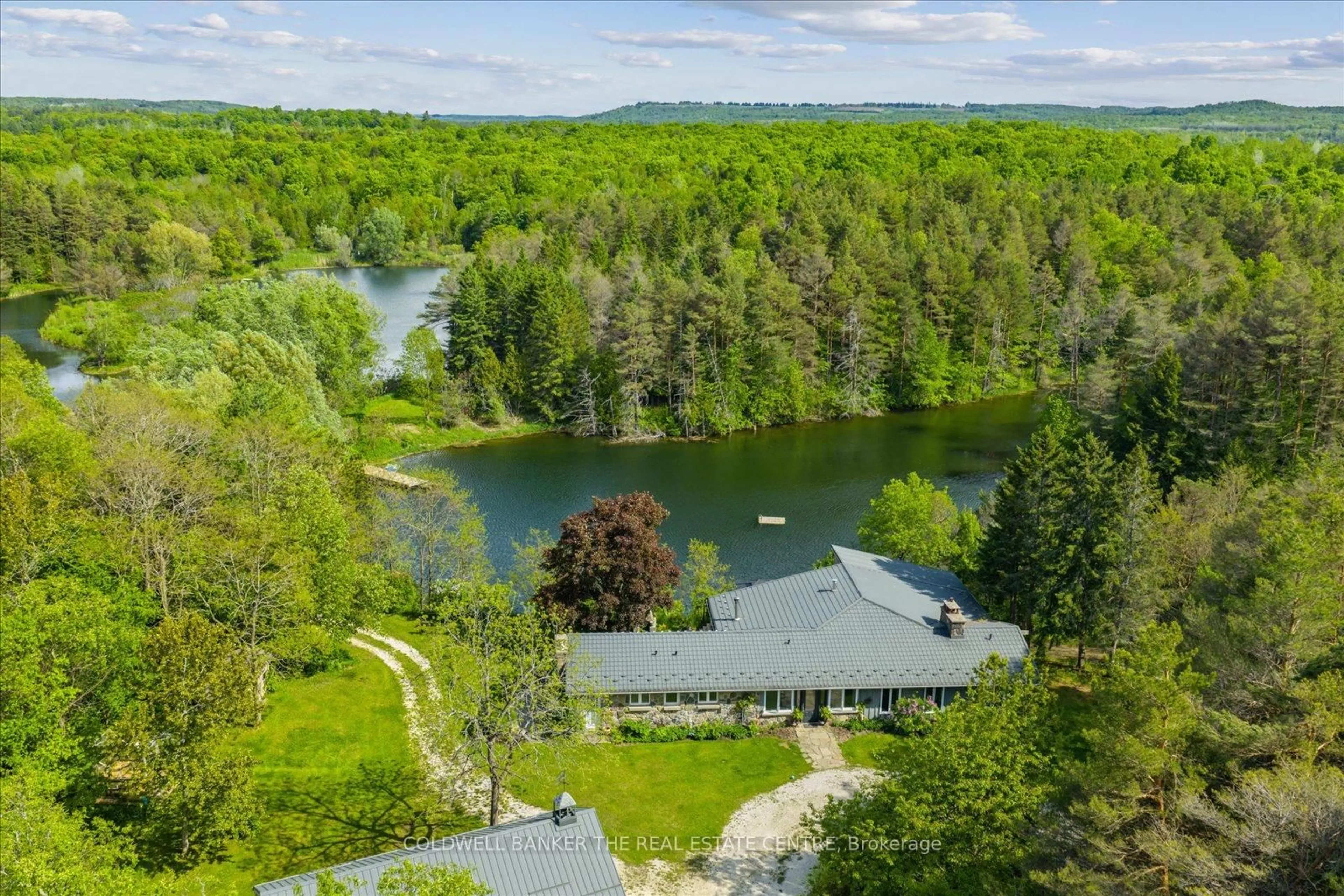 A pic from outside/outdoor area/front of a property/back of a property/a pic from drone, water/lake/river/ocean view for 798213 3rd Line, Mulmur Ontario L9V 0H7