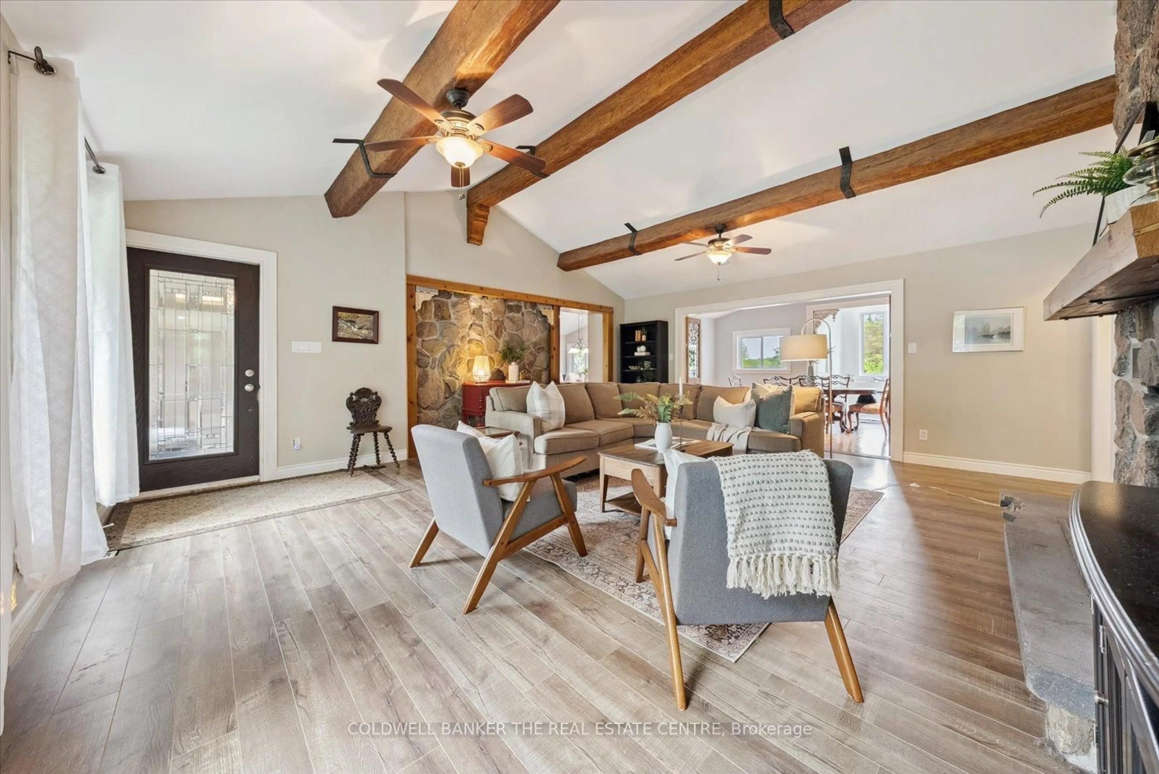 Living room with furniture, wood/laminate floor for 798213 3rd Line, Mulmur Ontario L9V 0H7