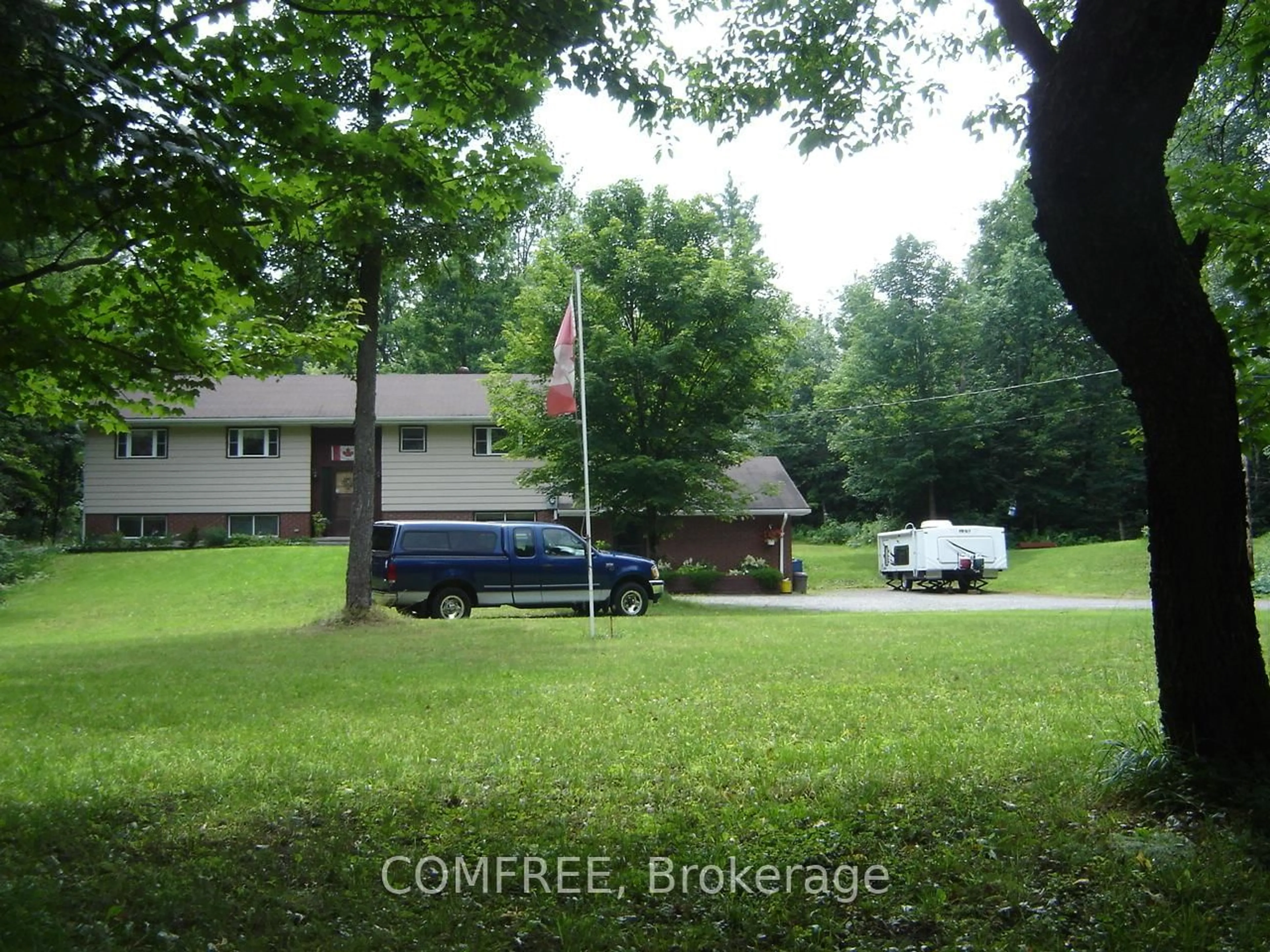 A pic from outside/outdoor area/front of a property/back of a property/a pic from drone, forest/trees view for 1021 Springdale Park Rd, Bracebridge Ontario P1L 1W9